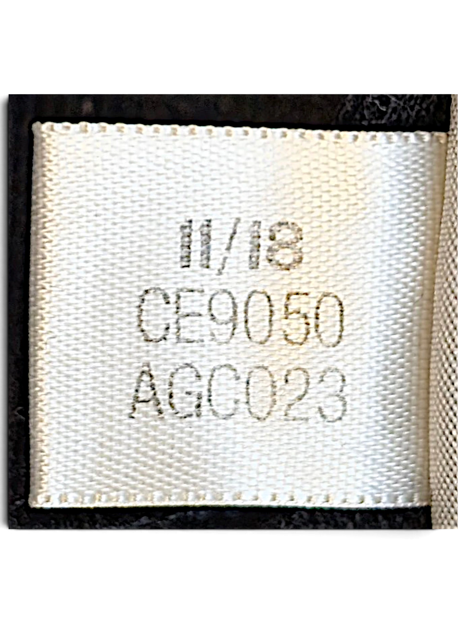 JAKE & IPI adidas track pants care label showing production date 11/18 and style code CE9050