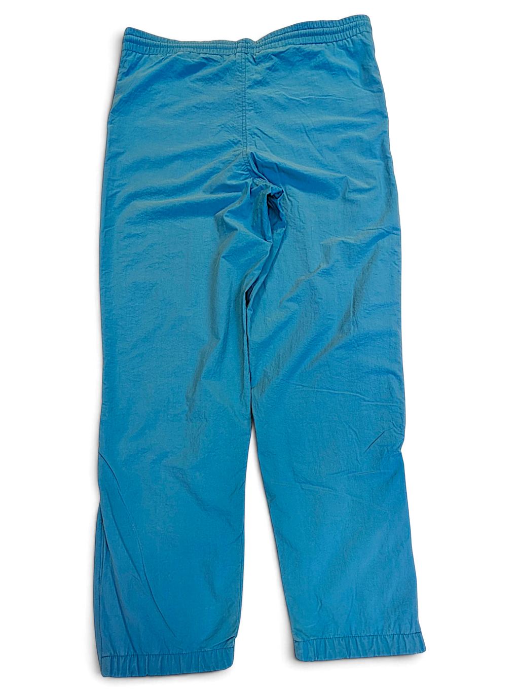 JAKE & IPI pre-owned Diadora track pants in faded light blue with a relaxed fit and elasticated waist.