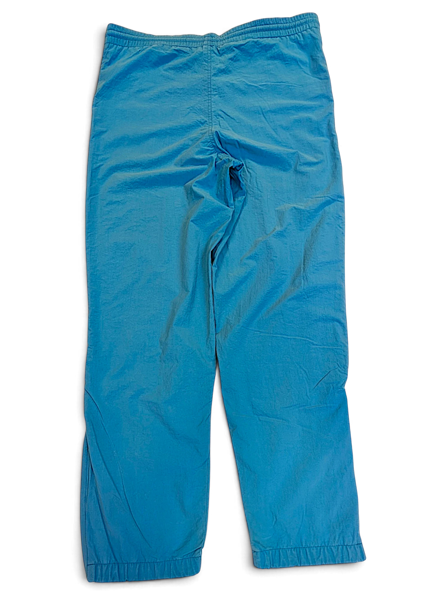 JAKE & IPI pre-owned Diadora track pants in faded light blue with a relaxed fit and elasticated waist.