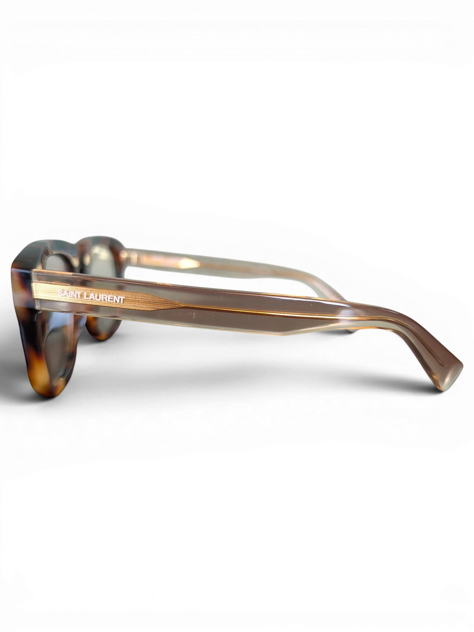 JAKE & IPI Saint Laurent SL558 sunglasses in a tortoiseshell acetate frame with gold logo detail, side view.