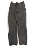 JAKE & IPI pre-owned black adidas track pants with signature white 3-stripes and a tapered leg silhouette.