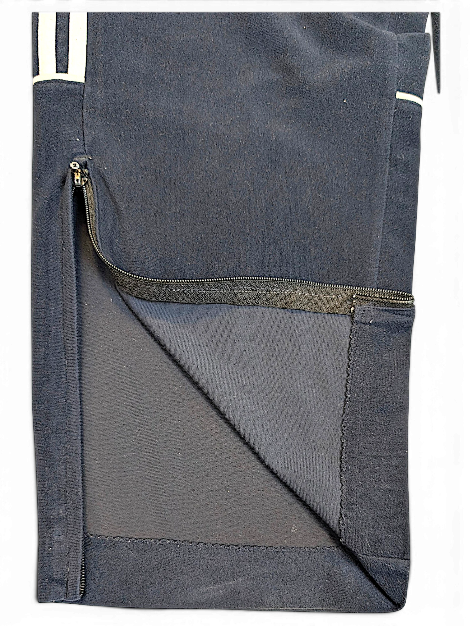 JAKE & IPI adidas blue velour track pants featuring a zippered leg opening and soft texture