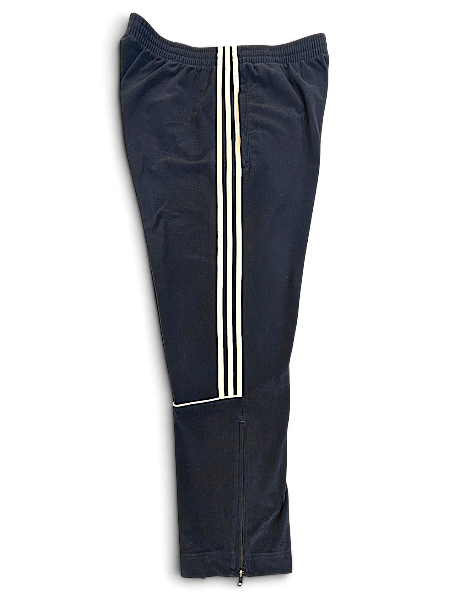 JAKE & IPI pre-owned blue adidas velour track pants with signature white side stripes and zippered leg openings.