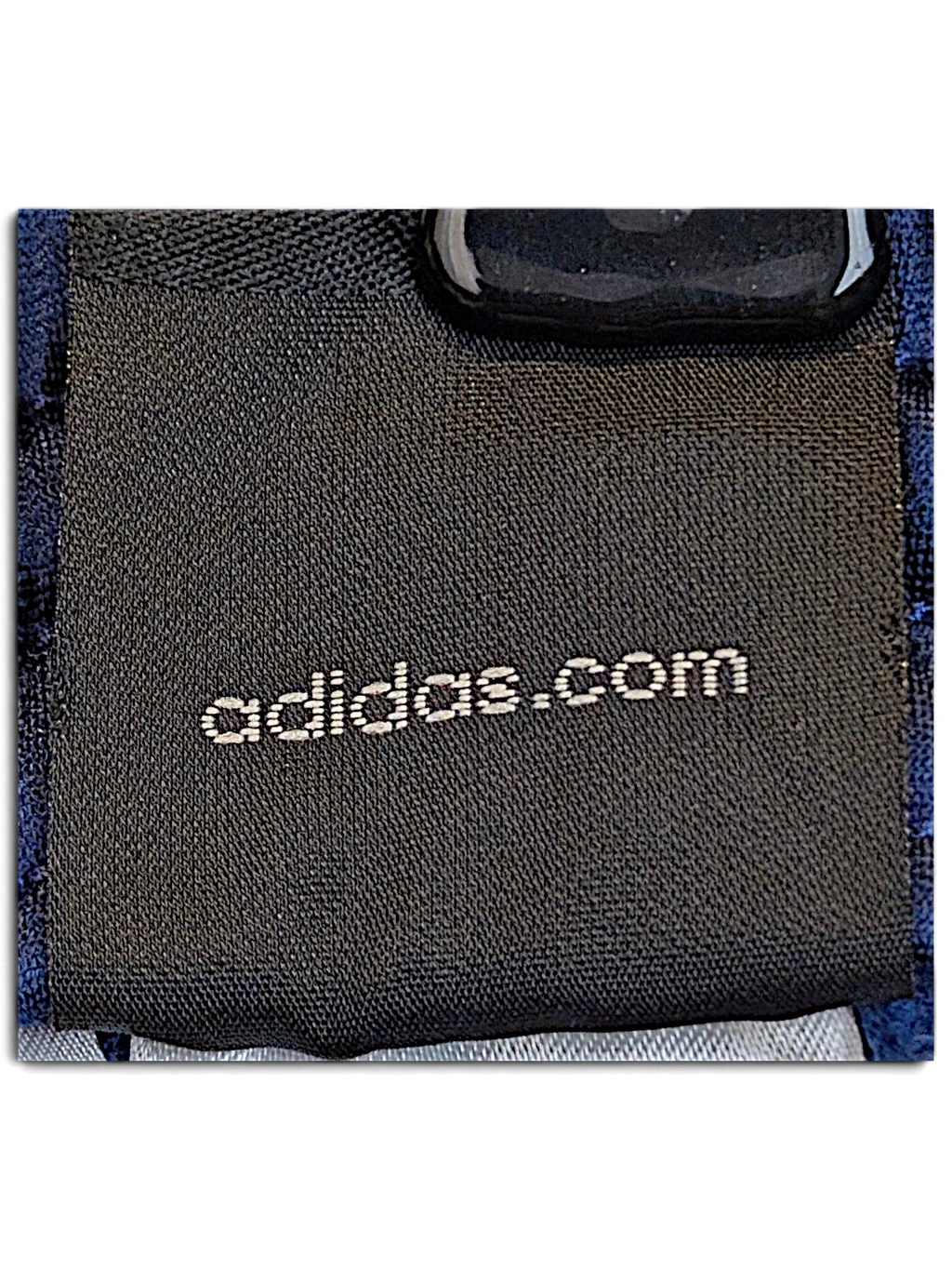 JAKE & IPI adidas brand label on navy and light blue track pants