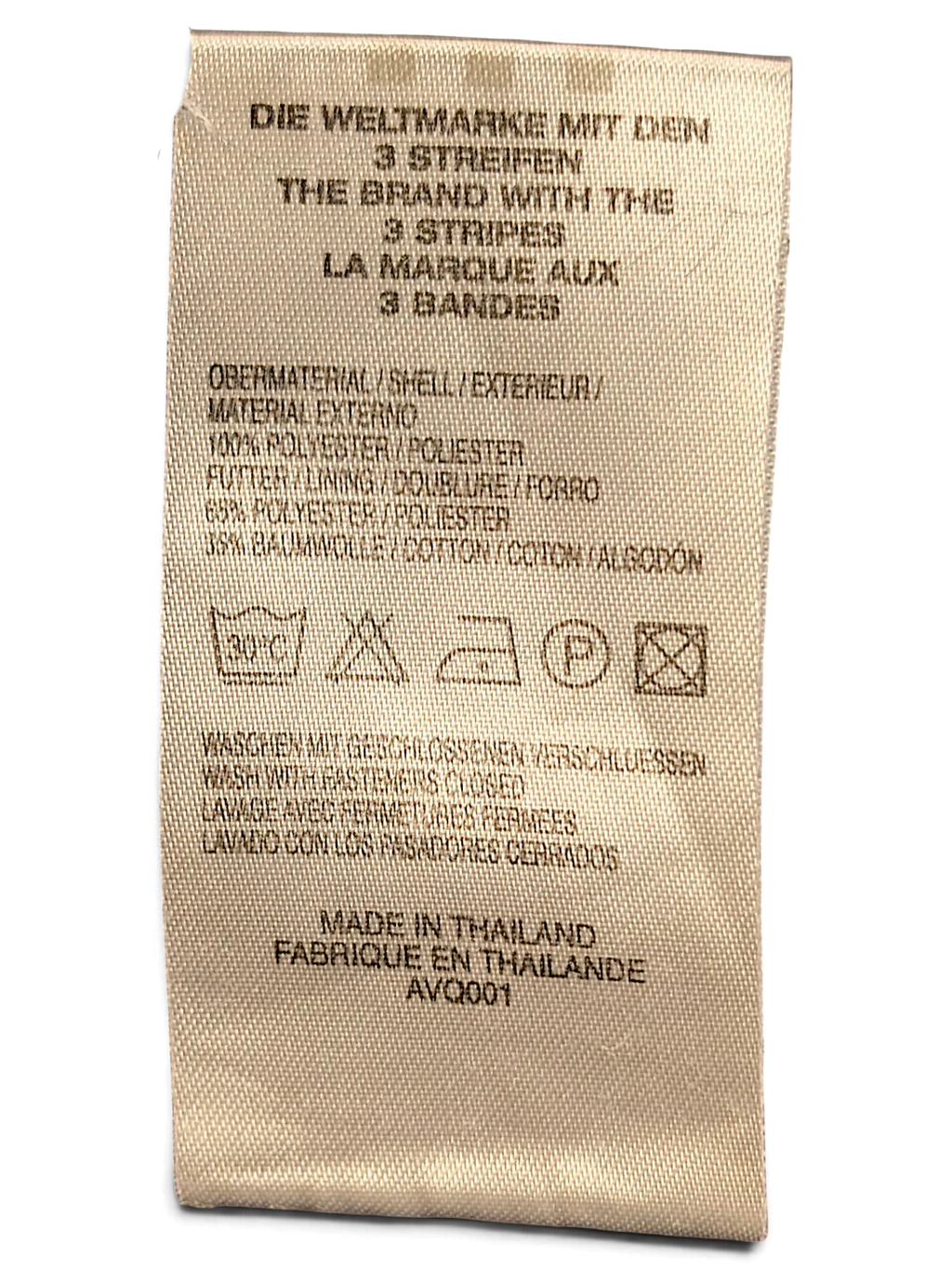 JAKE & IPI adidas track pants care label showing polyester and cotton composition and washing instructions