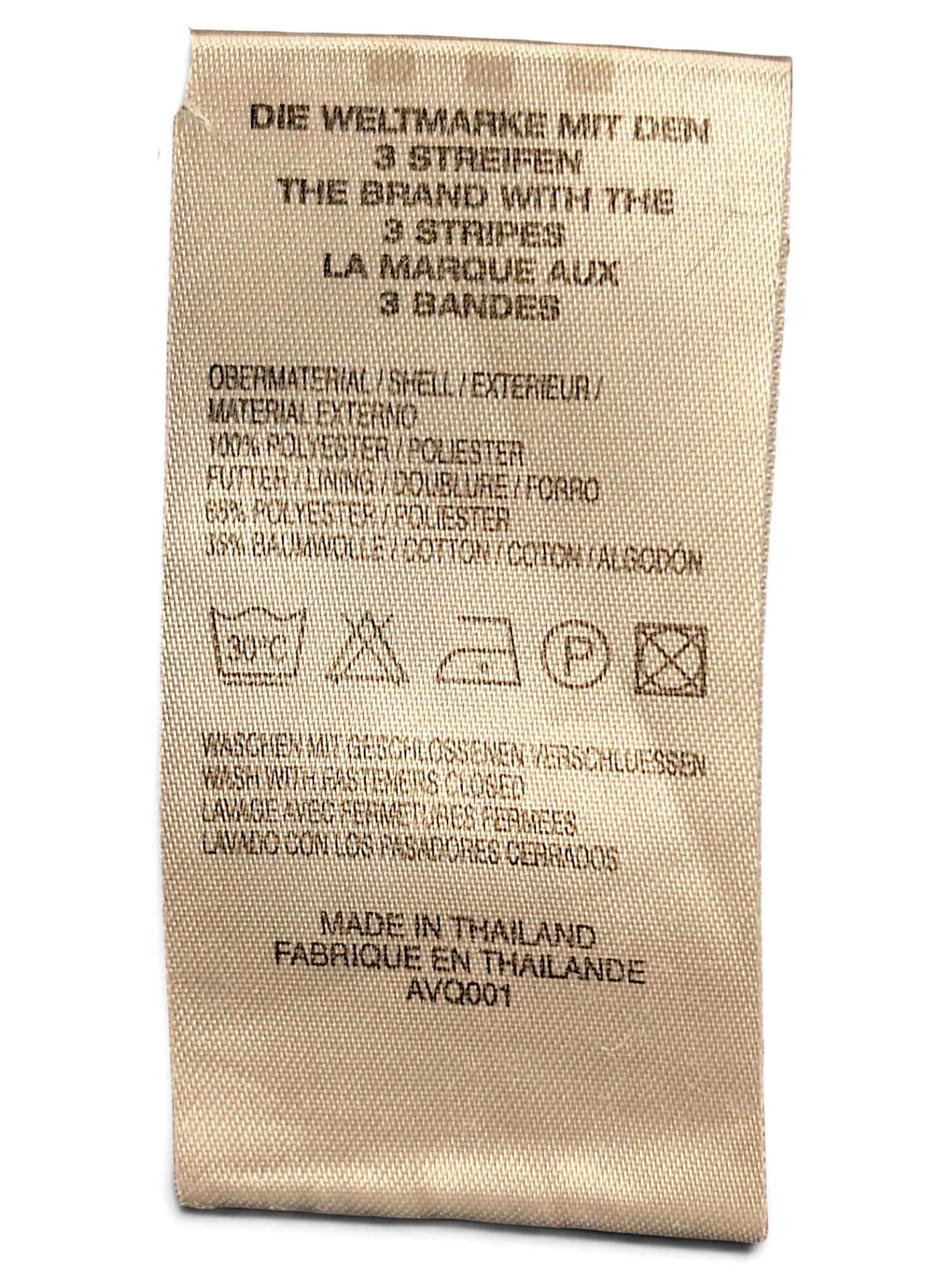 JAKE & IPI adidas track pants care label showing polyester and cotton composition and washing instructions
