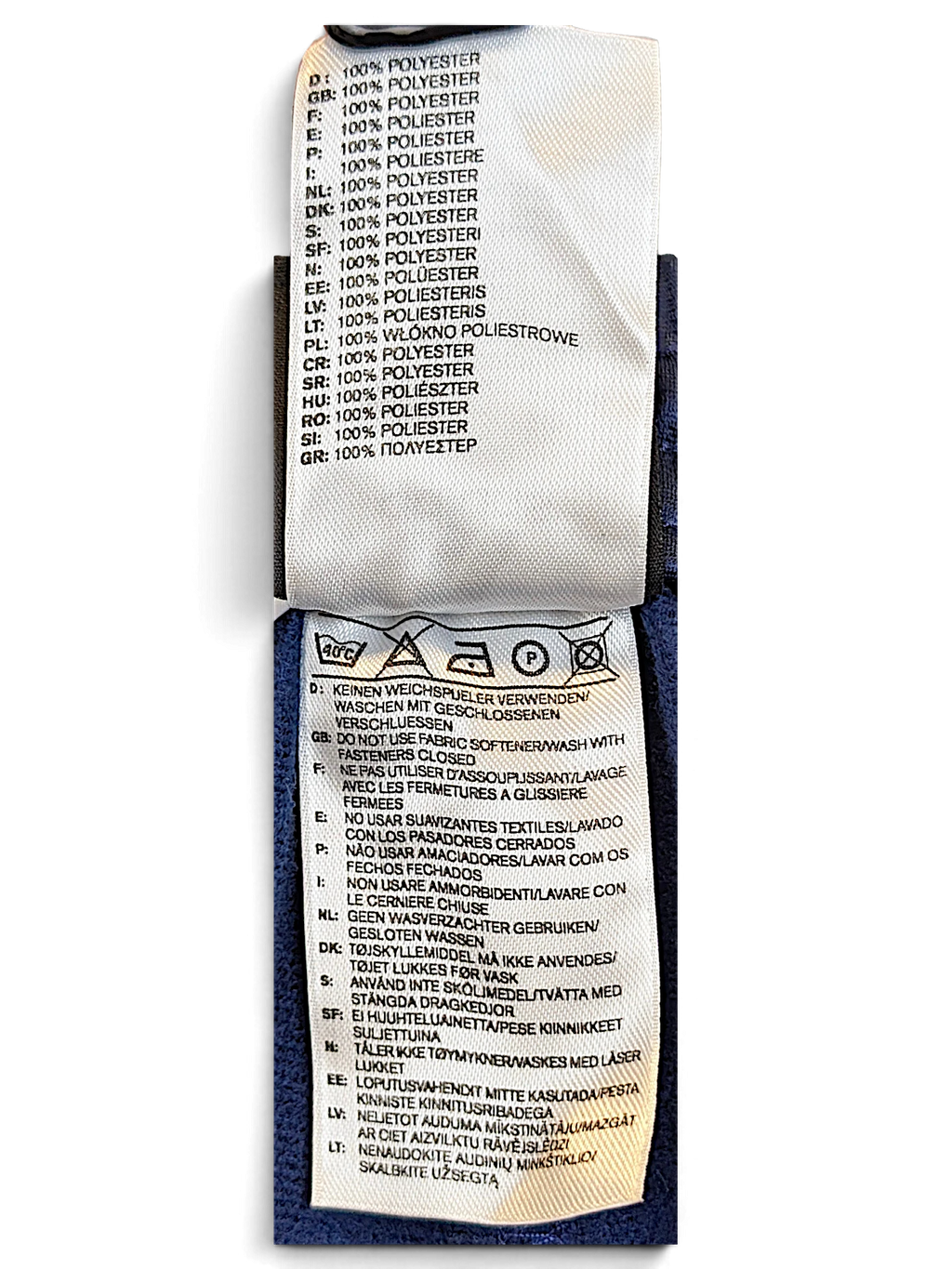 JAKE & IPI adidas track pants care and composition label showing 100 percent polyester material details