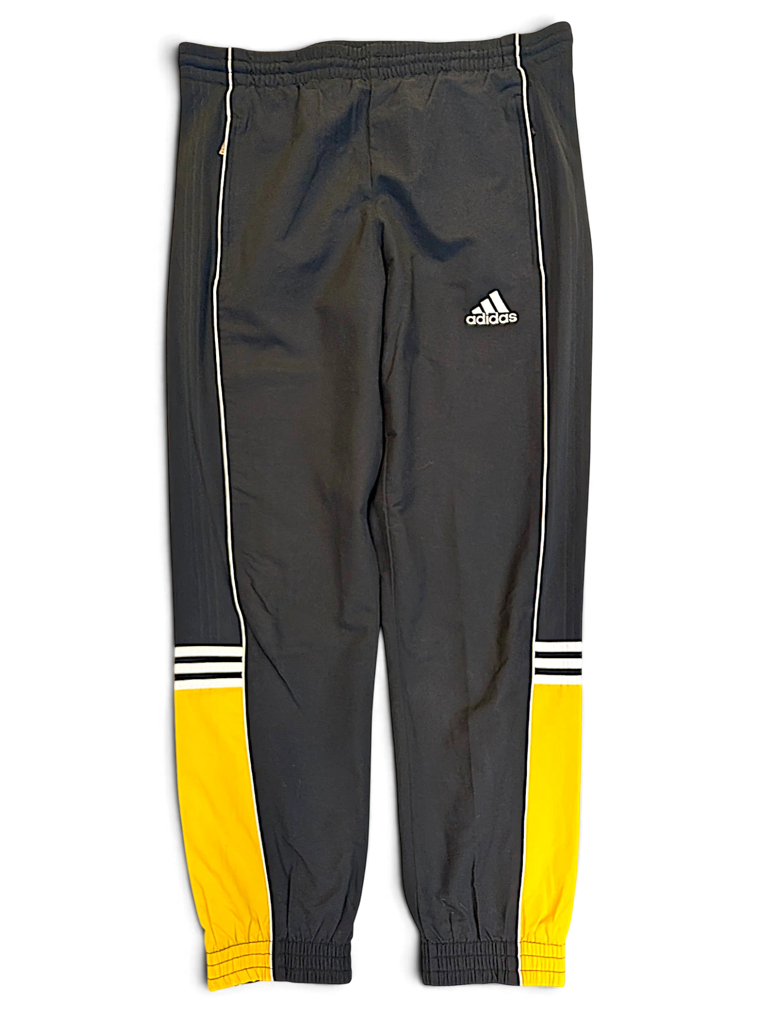 JAKE & IPI pre-owned adidas grey track pants with yellow panels, white piping, and signature branding on the leg.
