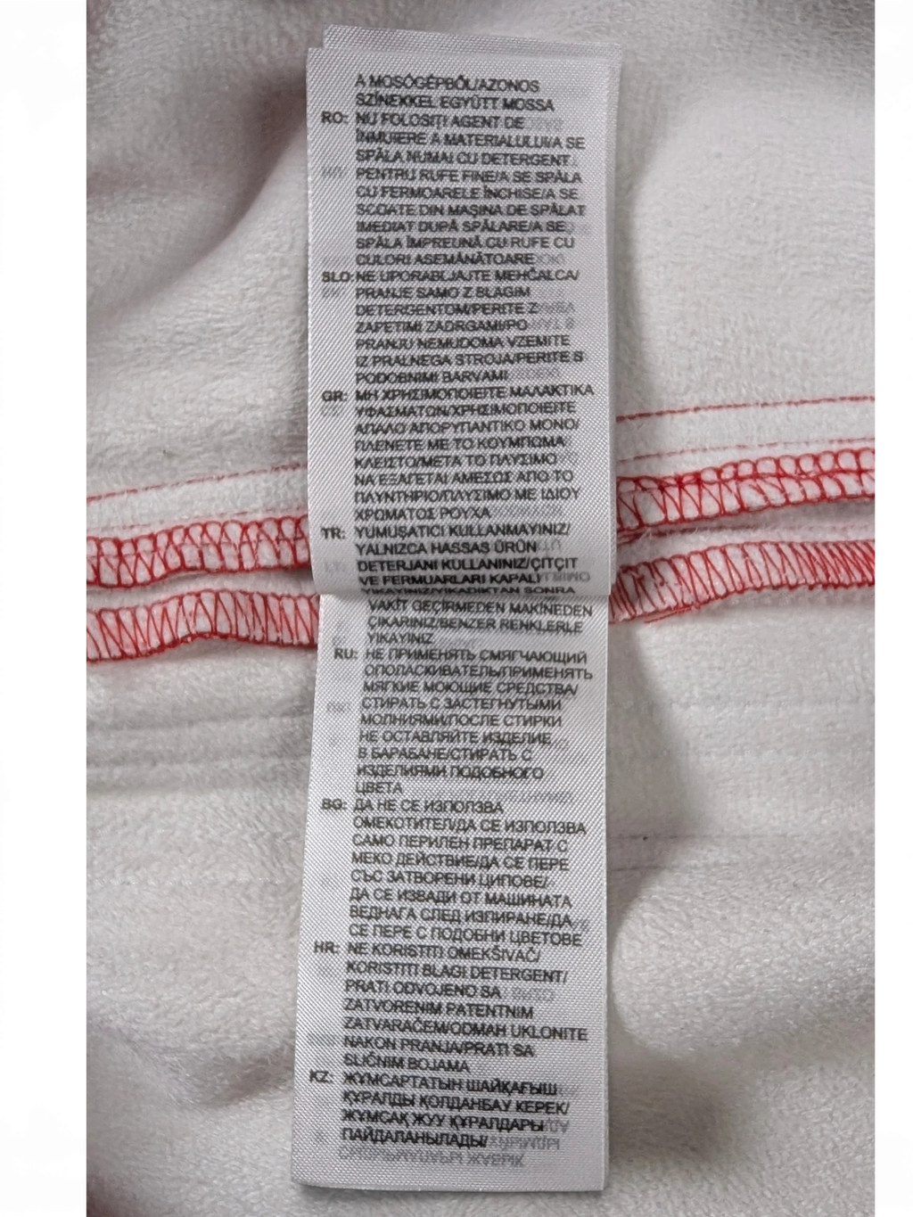 JAKE & IPI Adidas red leather pants garment care label with washing instructions in multiple languages