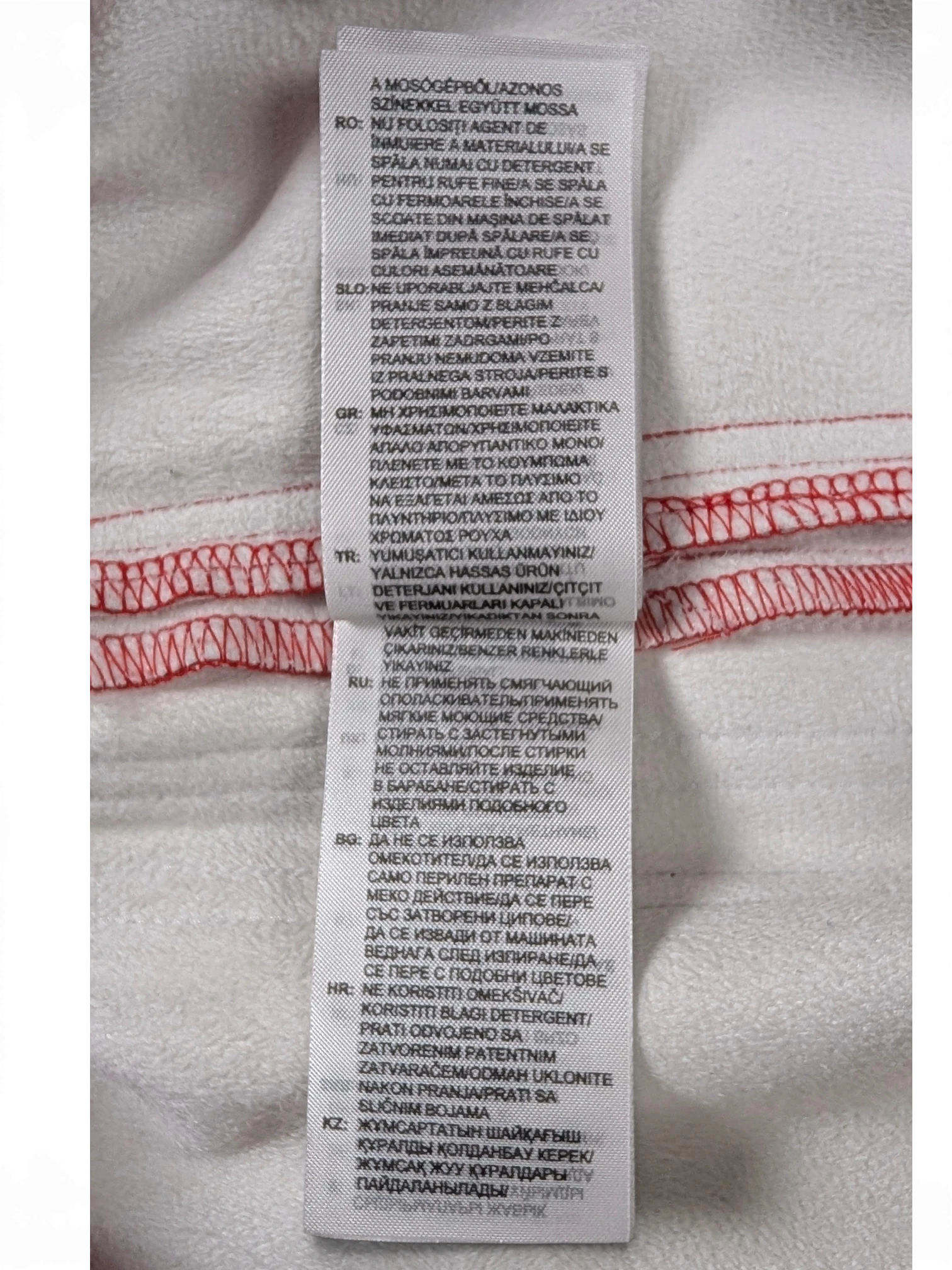 JAKE & IPI Adidas red leather pants garment care label with washing instructions in multiple languages