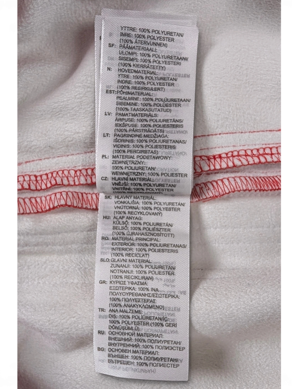 JAKE & IPI Adidas red leather pants care label detailing 100% polyurethane exterior and 100% polyester interior