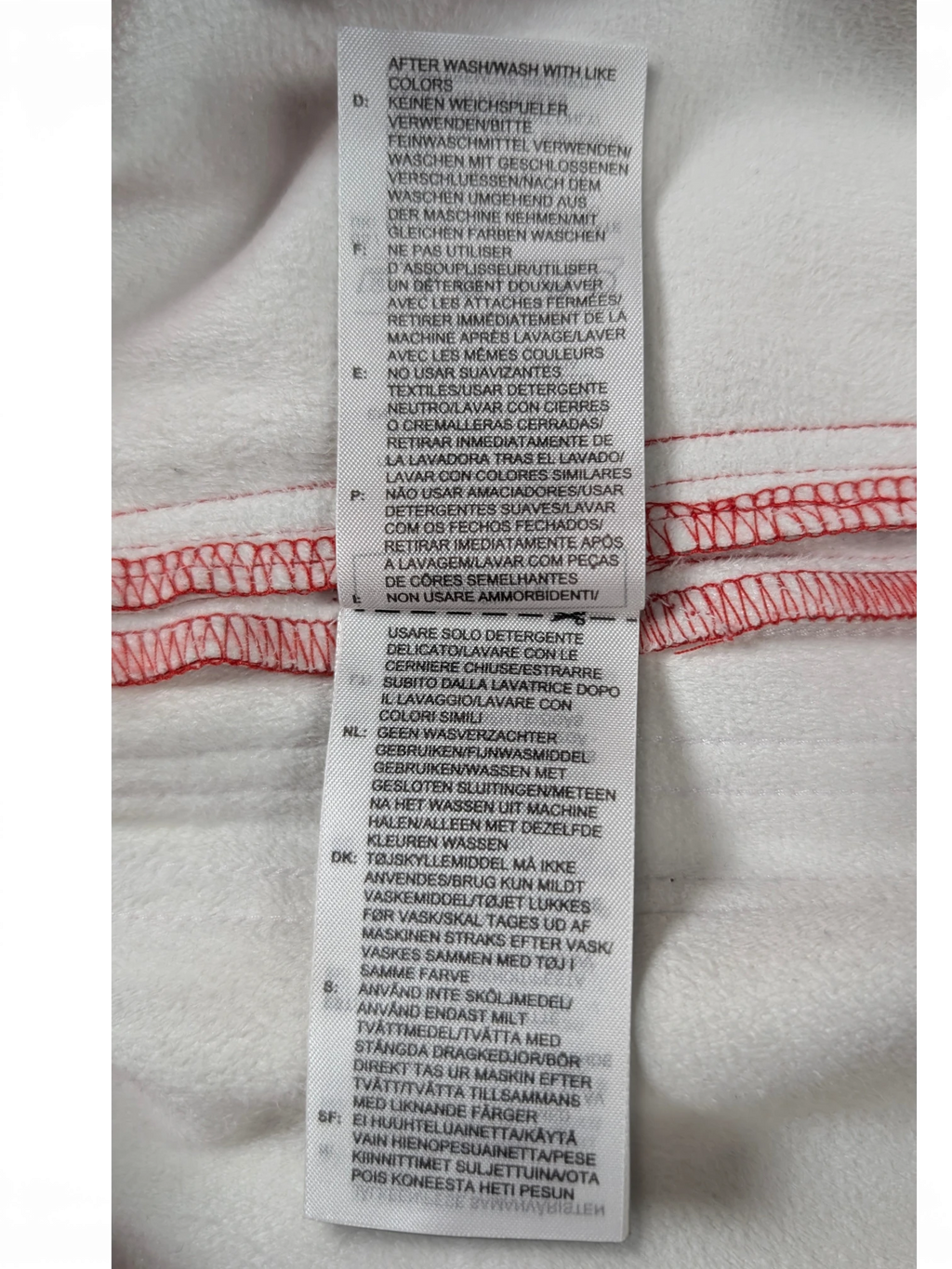 JAKE & IPI Adidas red leather pants garment care label with multi-language washing instructions