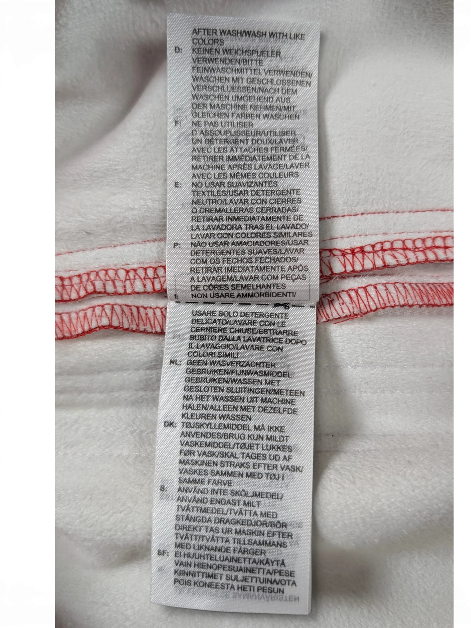 JAKE & IPI Adidas red leather pants garment care label with multi-language washing instructions