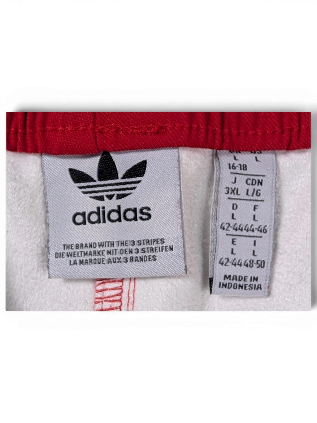 JAKE & IPI Adidas red leather pants interior label with size and branding details