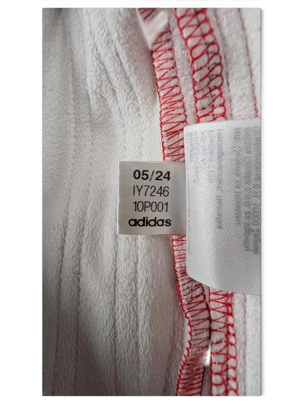 JAKE & IPI Adidas red leather pants interior care label with production date 05/24 and model code IY7246