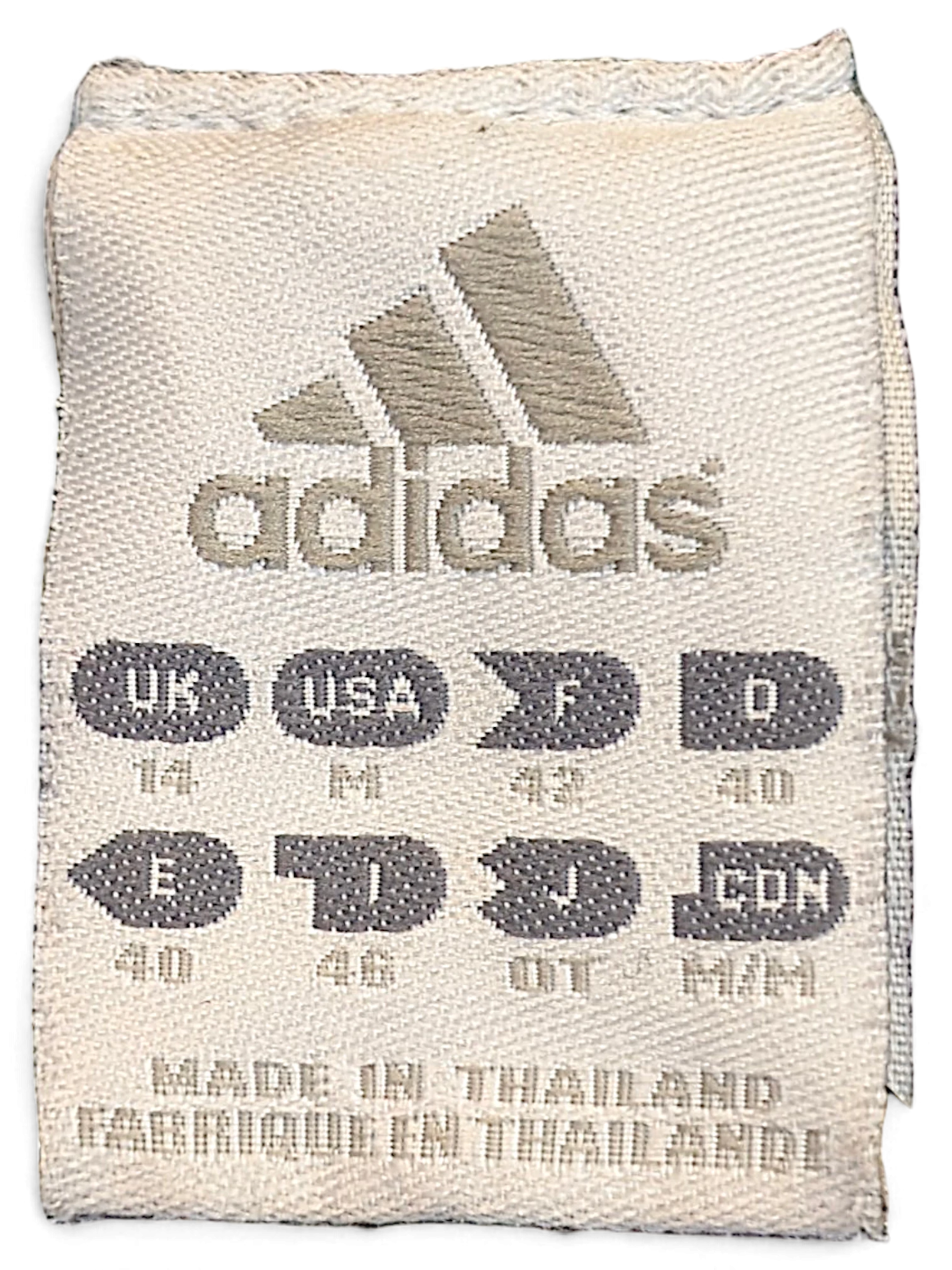 JAKE & IPI adidas track pants size label showing size M and manufacturing details on a white fabric tag