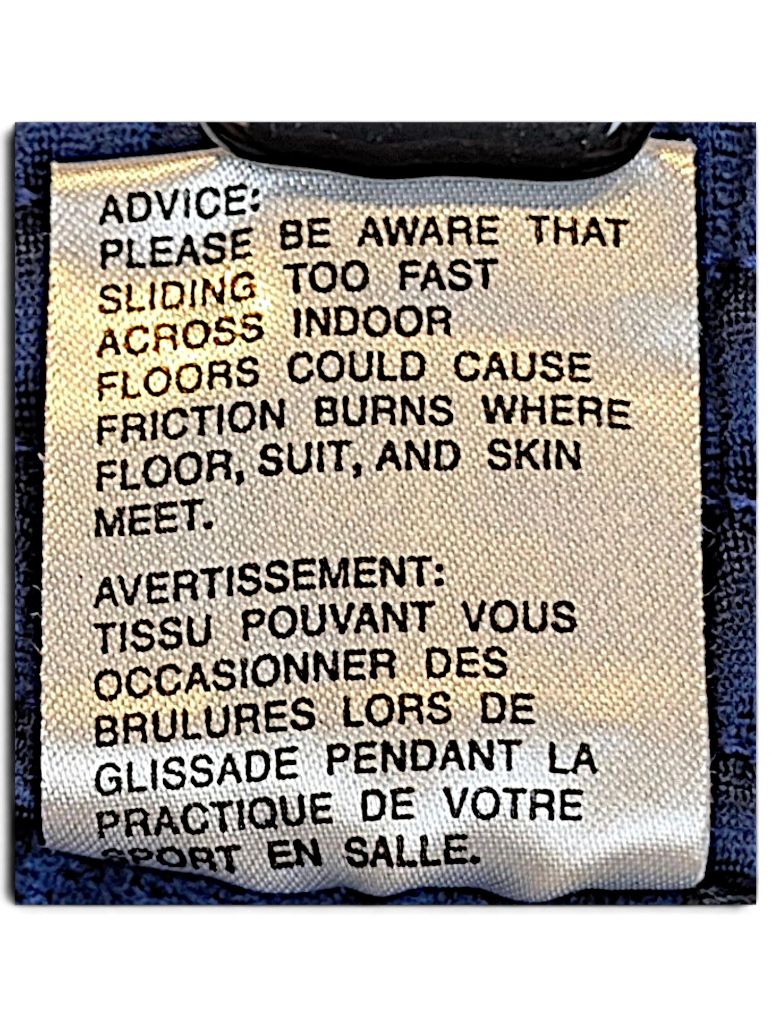 JAKE & IPI adidas track pants care label with safety warning text in English and French