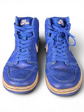 JAKE & IPI Air Jordan 1 Retro High Hyper Royal sneakers in blue leather with white Nike Air branding and worn details.