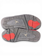JAKE & IPI Air Jordan 4 Red Thunder sneakers showing black and red rubber outsoles with Jumpman logo detailing.