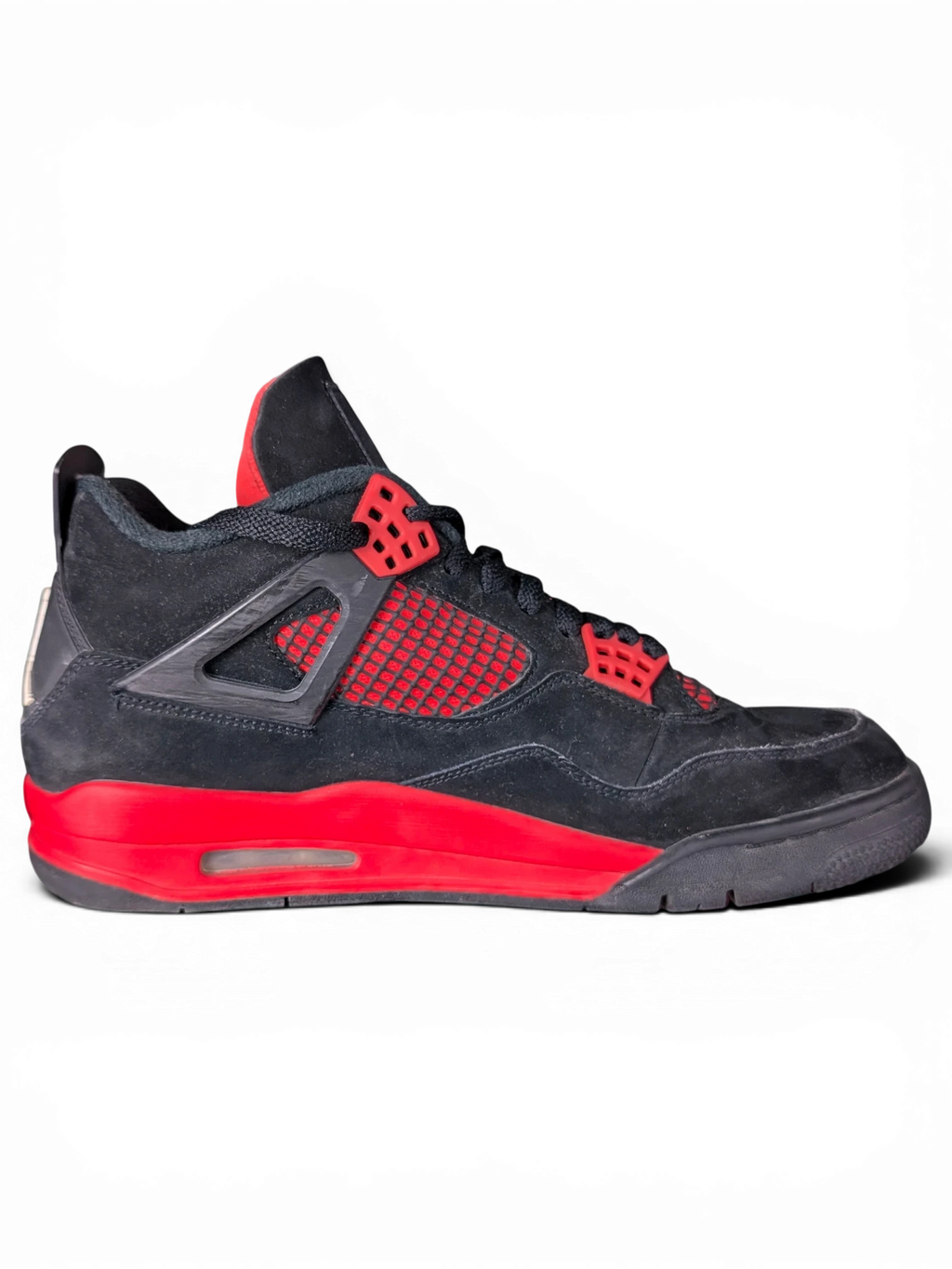 JAKE & IPI Air Jordan 4 Red Thunder sneakers in black and red suede with visible wear on a black background.