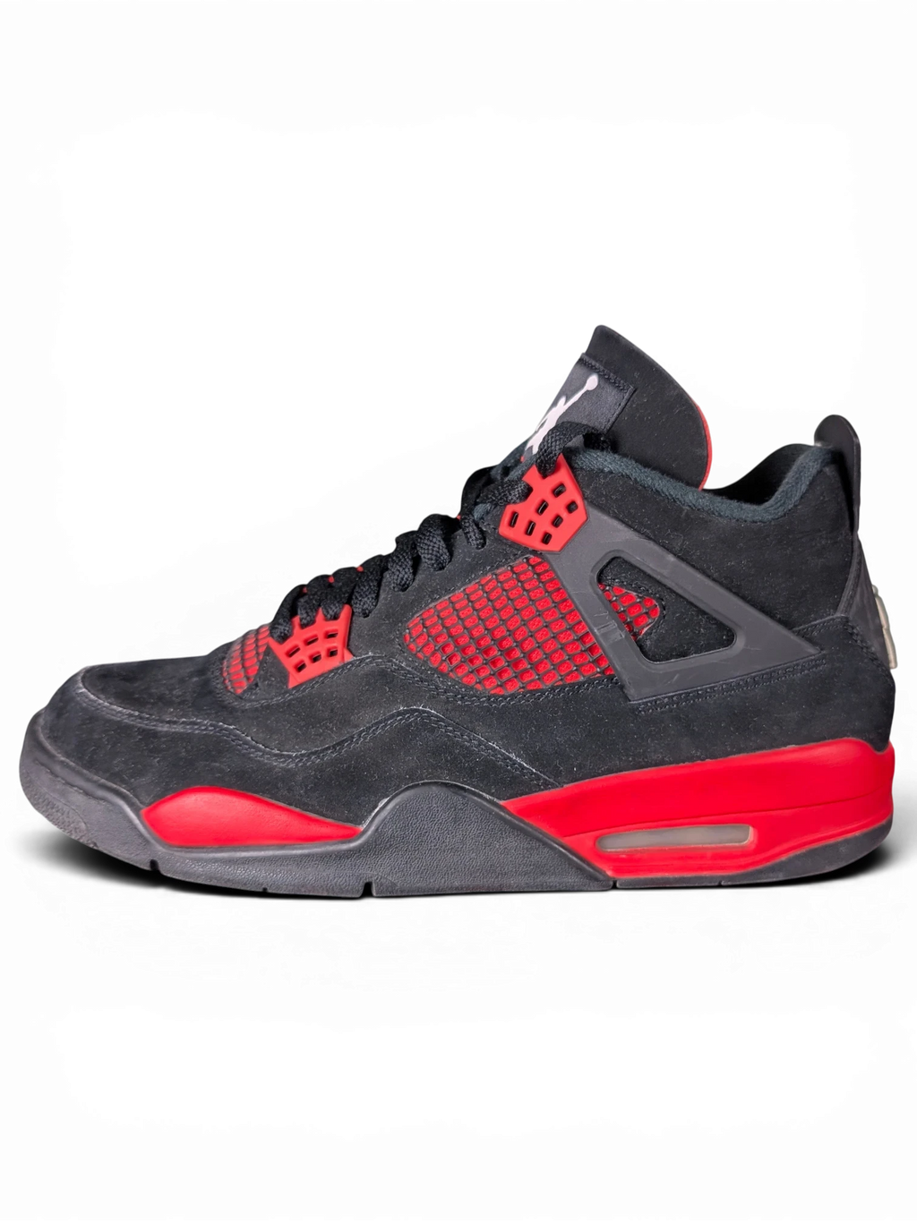 JAKE & IPI Air Jordan 4 Red Thunder sneakers in black and red suede with visible wear on a black background