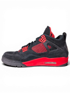 JAKE & IPI Air Jordan 4 Red Thunder sneakers in black suede with red accents and visible wear on a black background.
