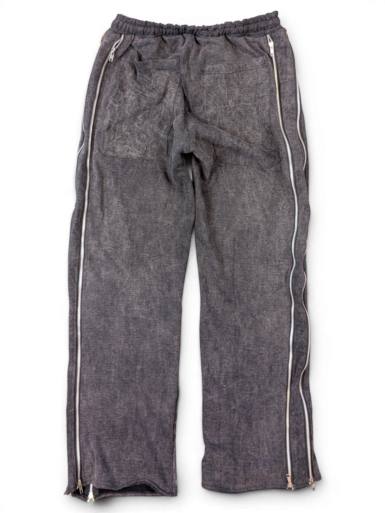 JAKE & IPI Alarikco track suit pants in charcoal grey with full-length side zippers on a black background
