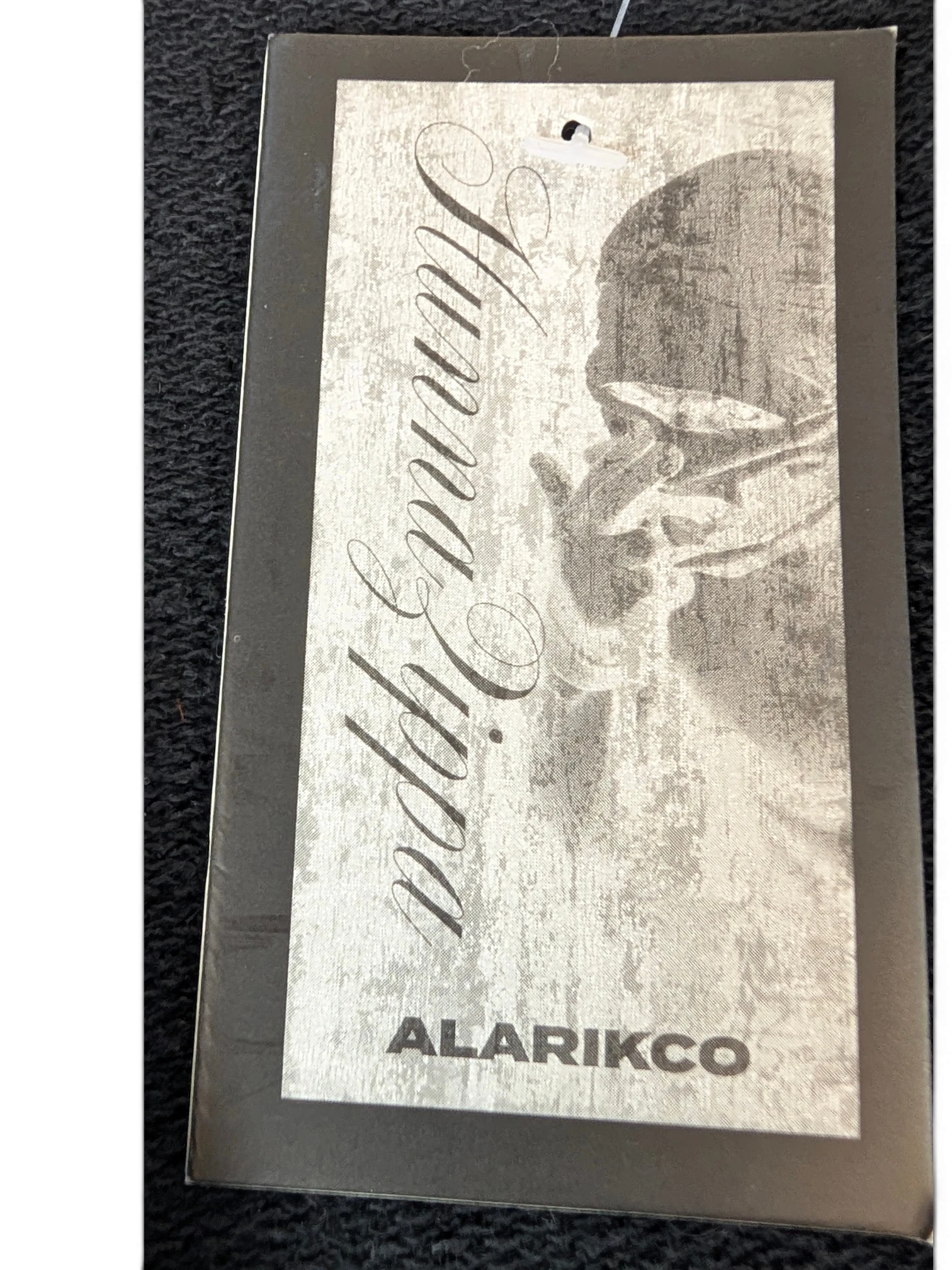 JAKE & IPI Alarikco track suit clothing brand tag with distressed grey graphic design and elegant script text