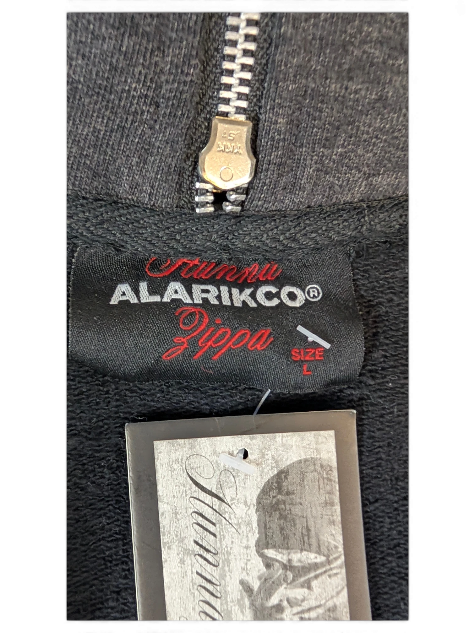 JAKE & IPI Alarikco Zippa black track suit jacket label with silver YKK zipper and size L tag