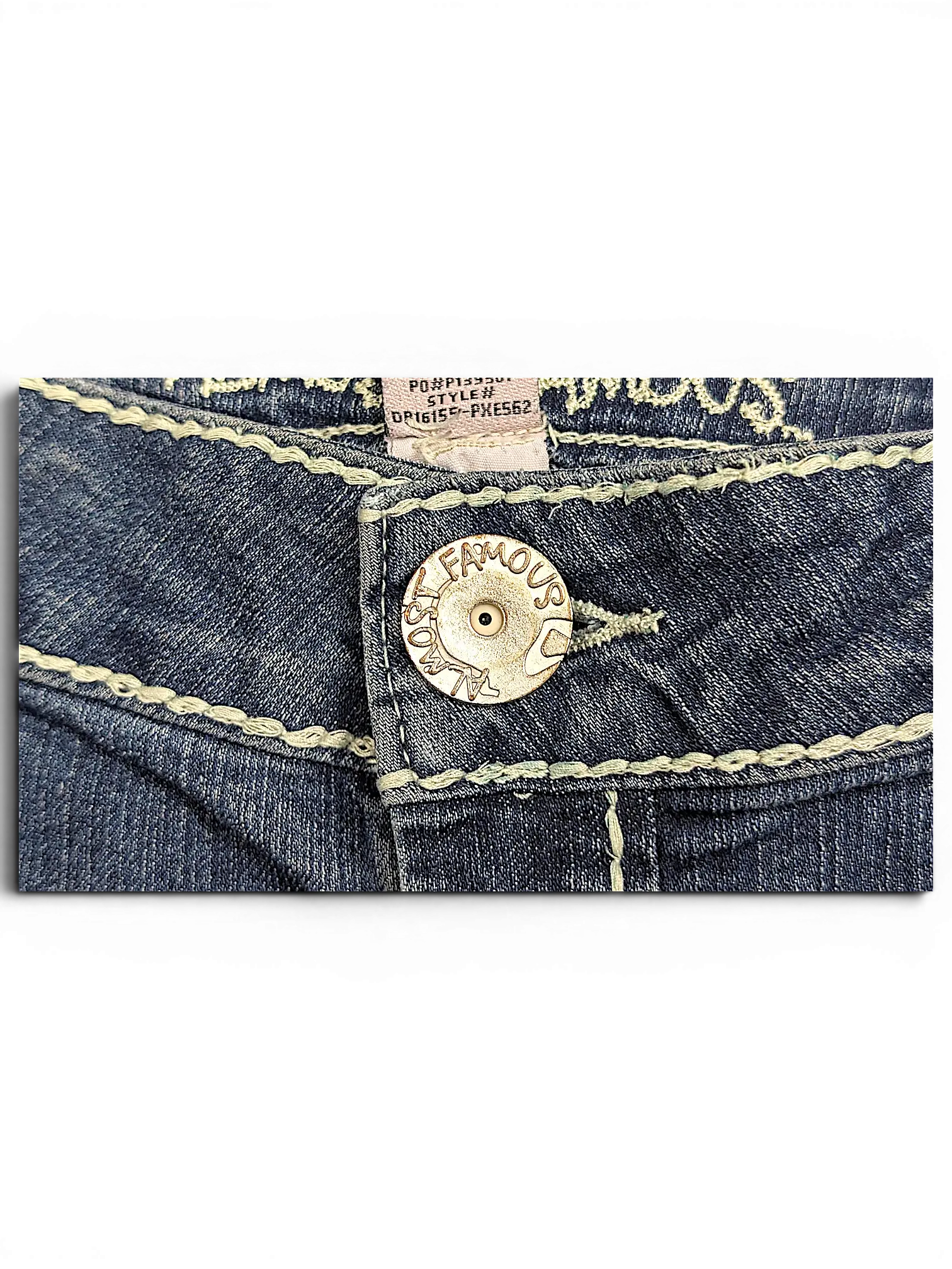 JAKE & IPI Almost Famous blue denim jeans featuring a branded metal button and light contrast stitching