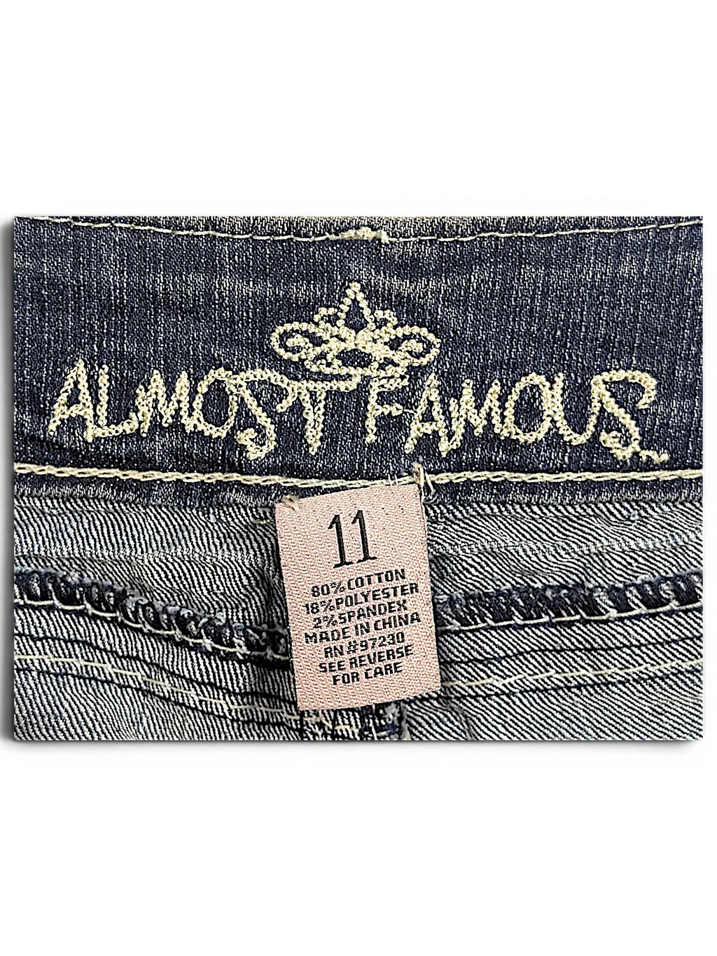 JAKE & IPI Almost Famous size 11 distressed blue denim jeans interior label with cotton blend fabric details