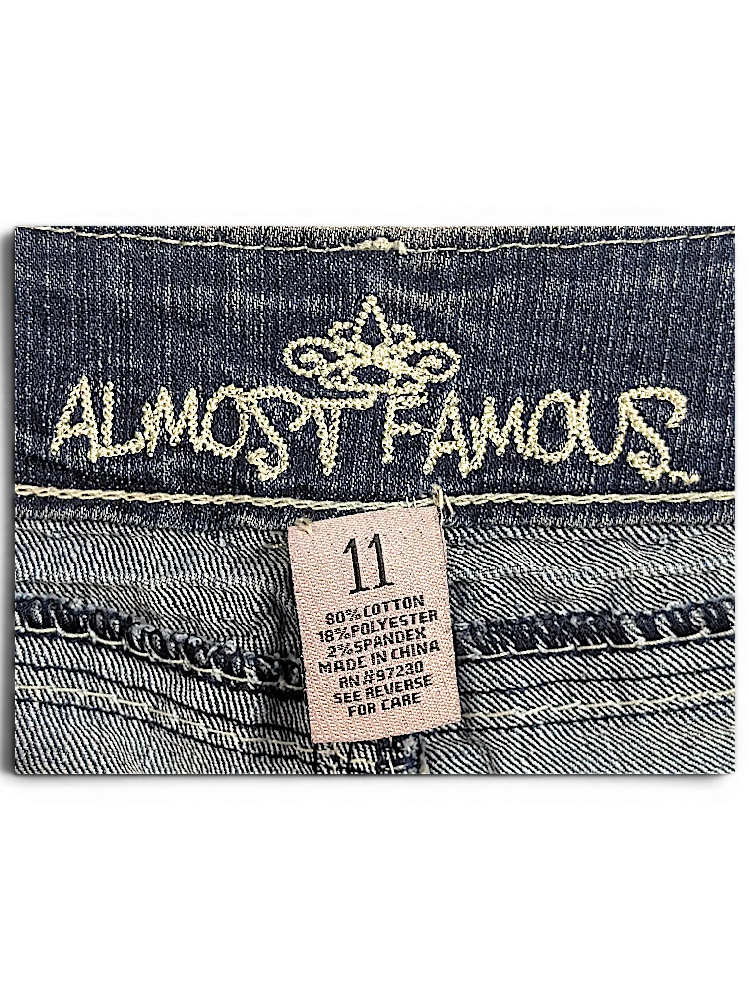 JAKE & IPI Almost Famous size 11 distressed blue denim jeans interior label with cotton blend fabric details