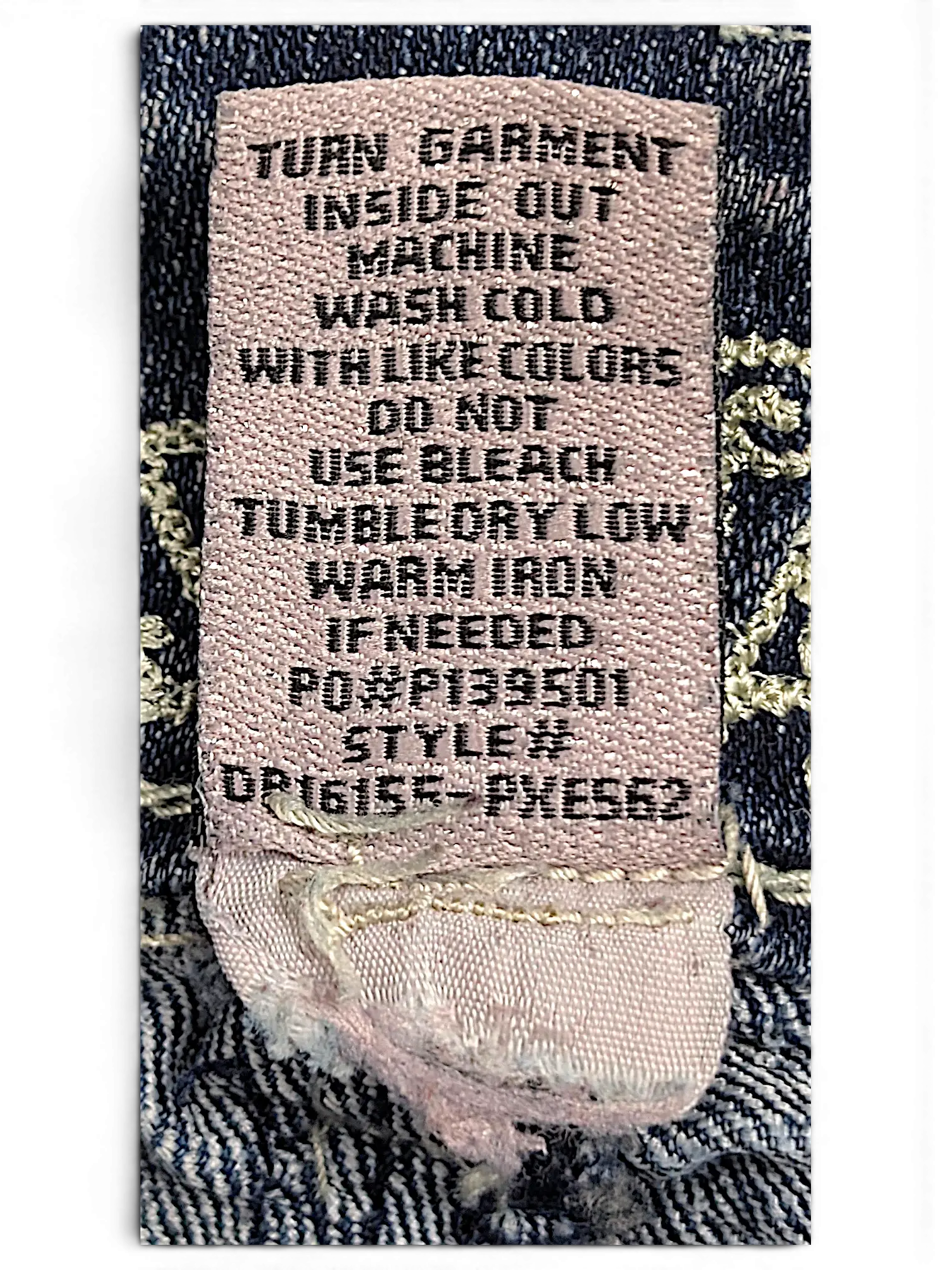 JAKE & IPI Almost Famous distressed jeans care label with washing instructions and style number details
