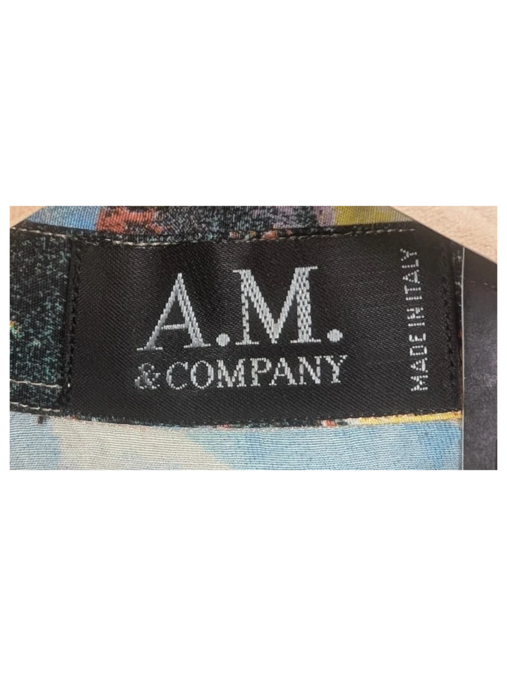 JAKE & IPI A.M. & Company vintage Hawaiian shirt label detail with colorful floral print fabric