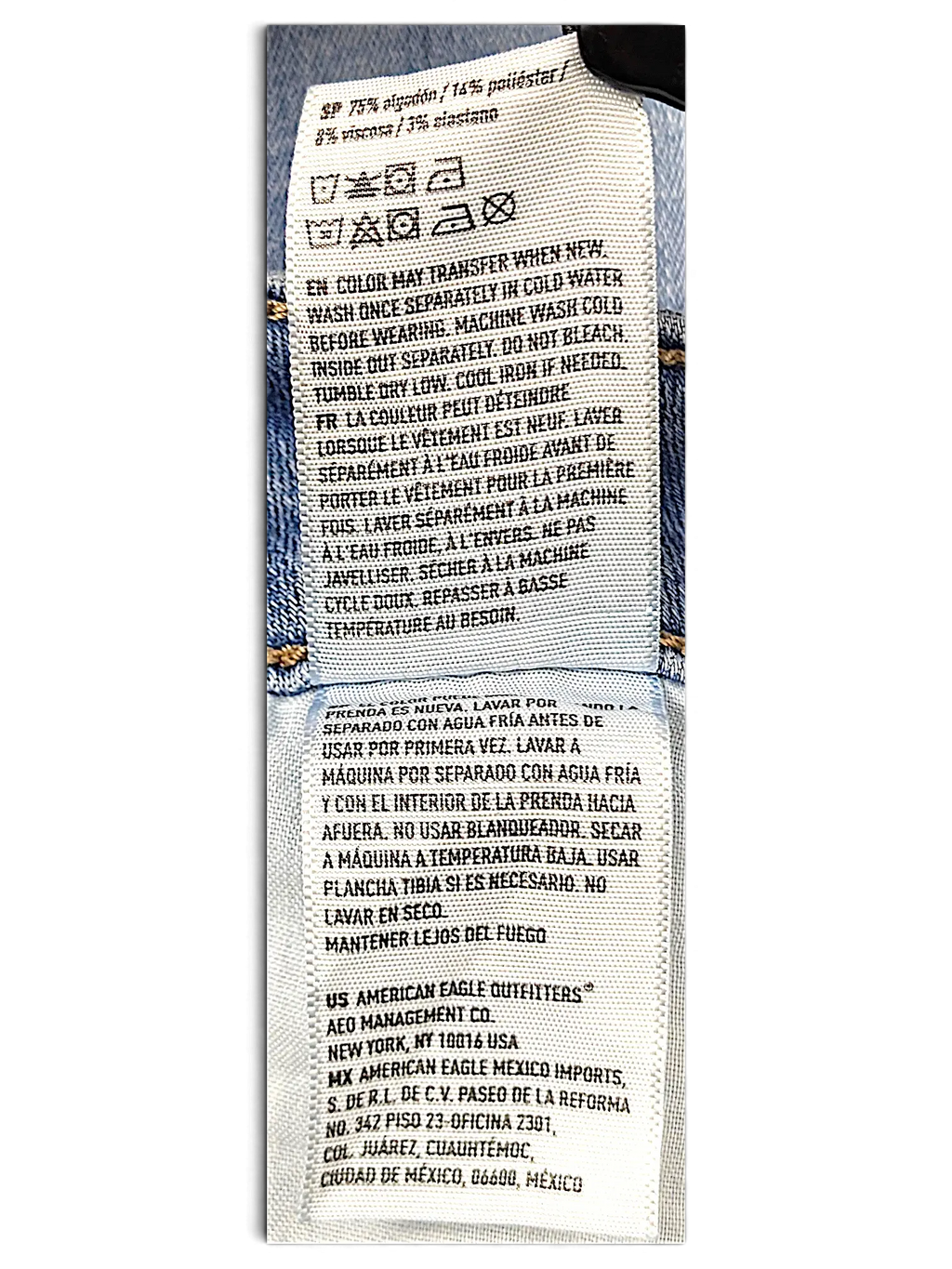 JAKE & IPI American Eagle Outfitters denim jeans care label with fabric composition and washing instructions
