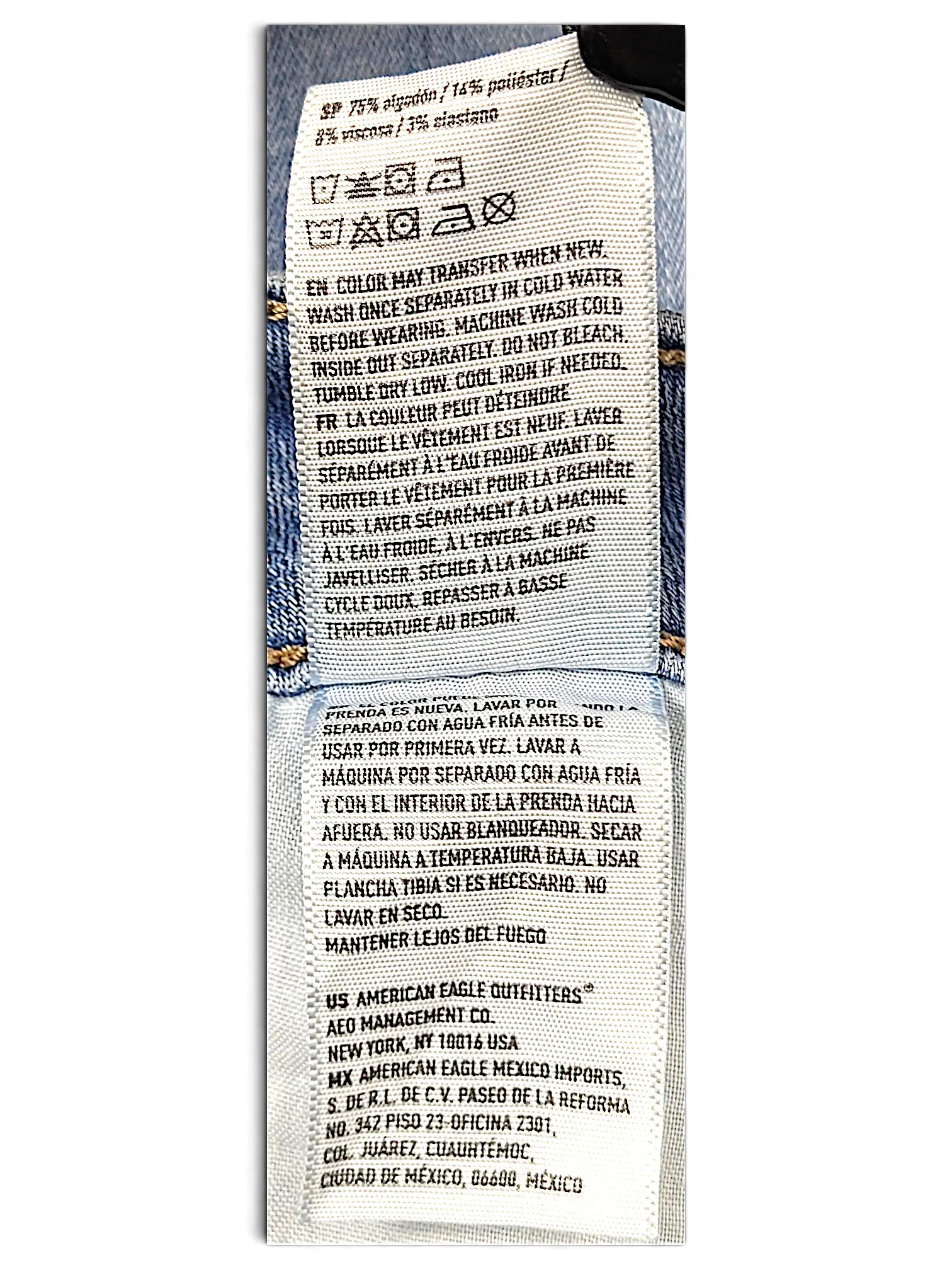 JAKE & IPI American Eagle Outfitters denim jeans care label with fabric composition and washing instructions