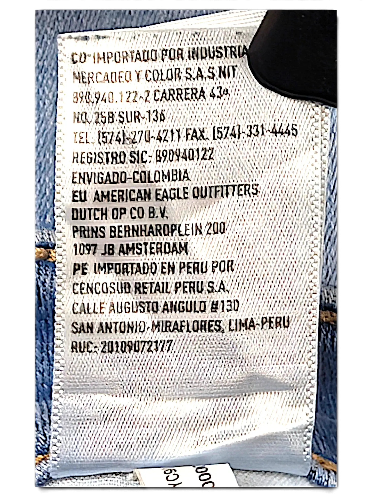 JAKE & IPI American Eagle Outfitters 2Long blue denim jeans interior care label with manufacturing details