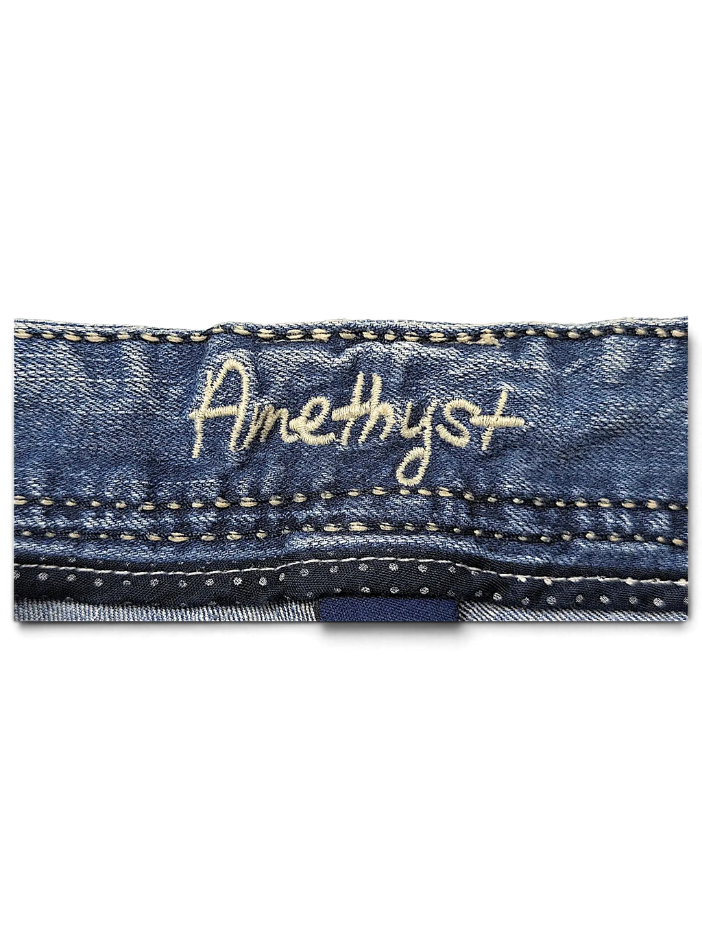 JAKE & IPI Amethyst Y2K jeans featuring blue denim fabric with embroidered brand logo on the waistband