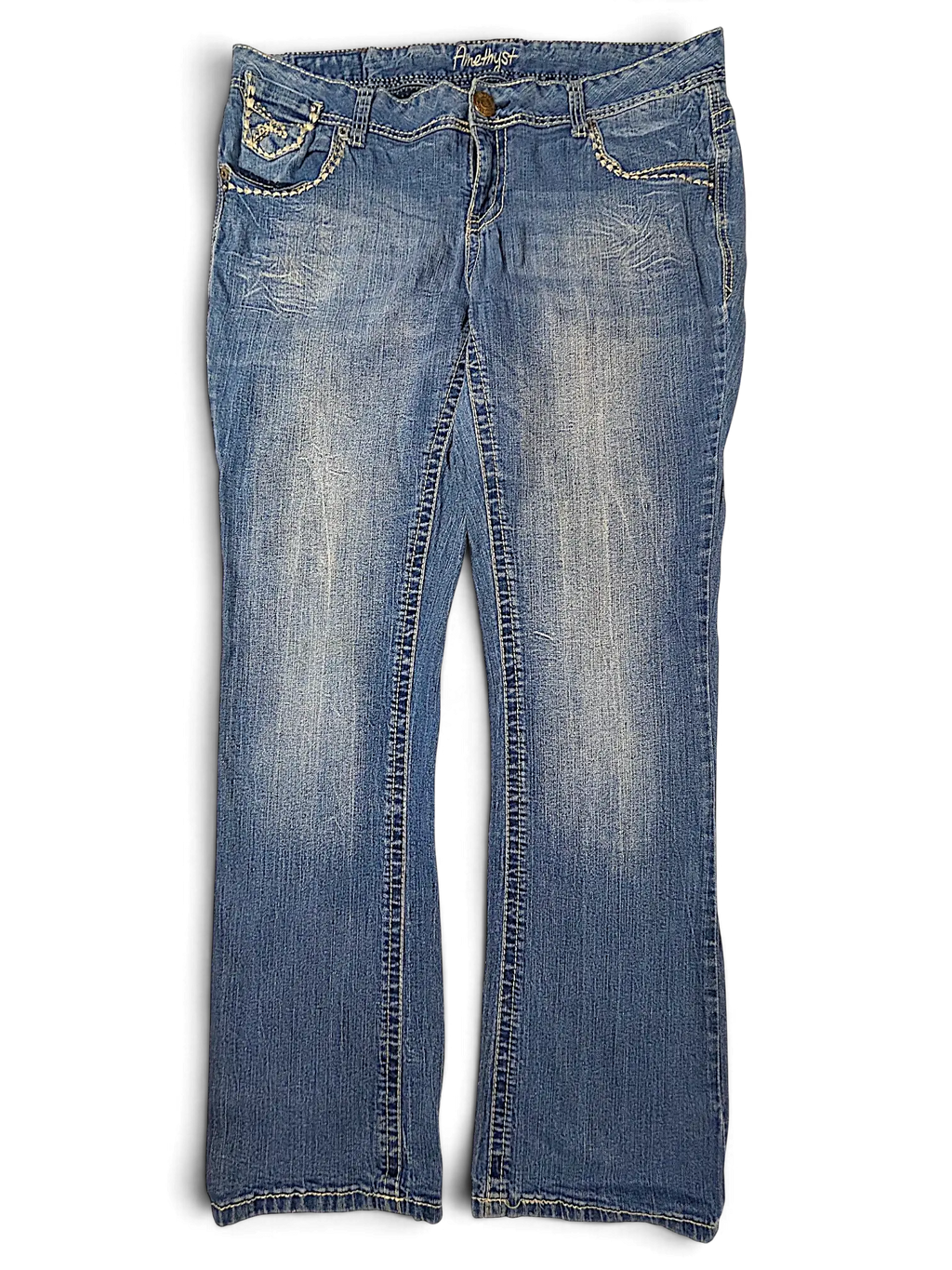 JAKE & IPI Amethyst Y2K blue denim jeans with decorative stitching and whiskering details on the front pockets.
