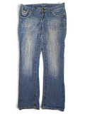 JAKE & IPI Amethyst Y2K blue denim jeans with decorative stitching and whiskering details on the front pockets.