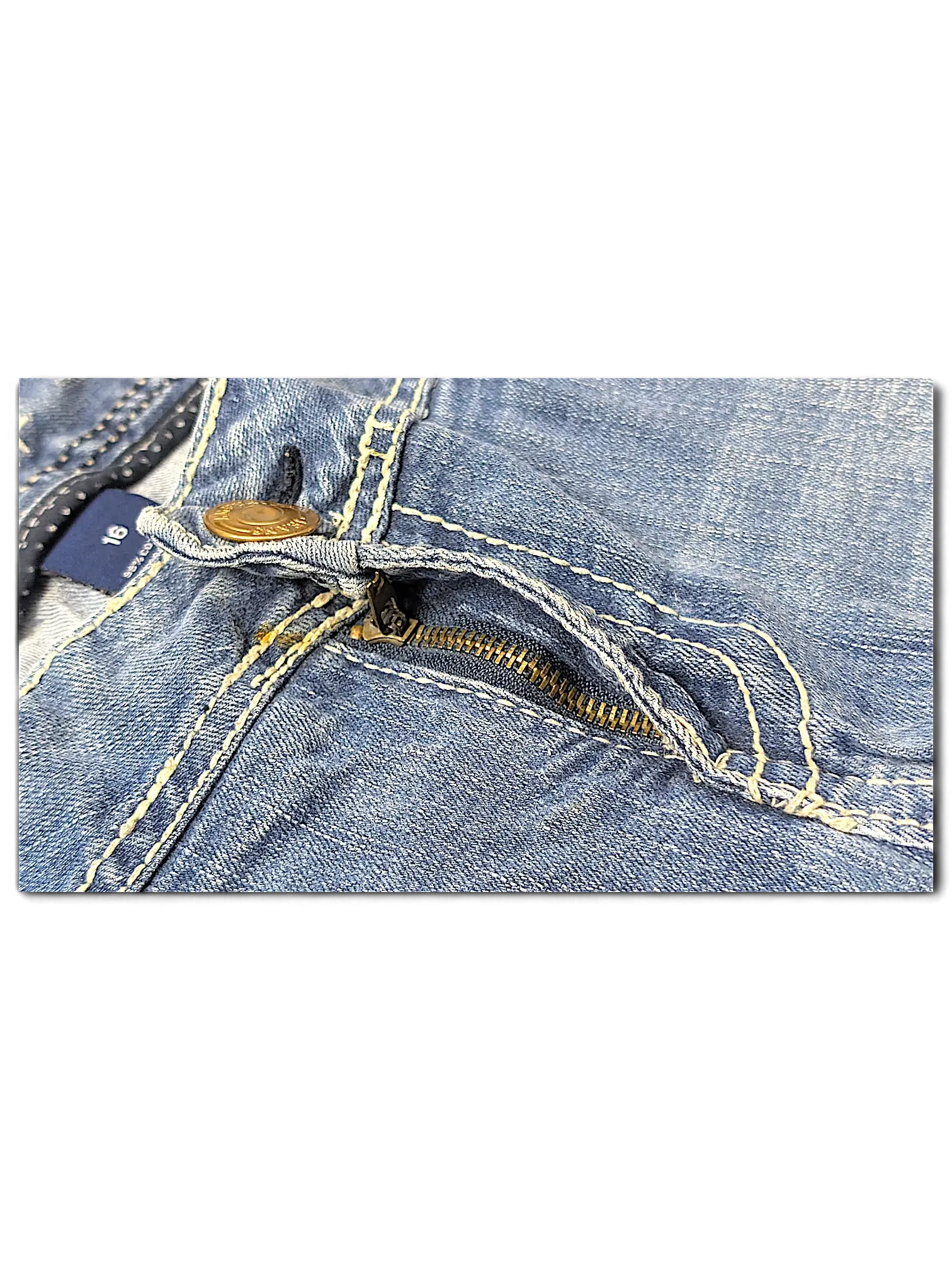 JAKE & IPI Amethyst Y2K jeans featuring light blue denim, contrast stitching, and a metal button fly closure.