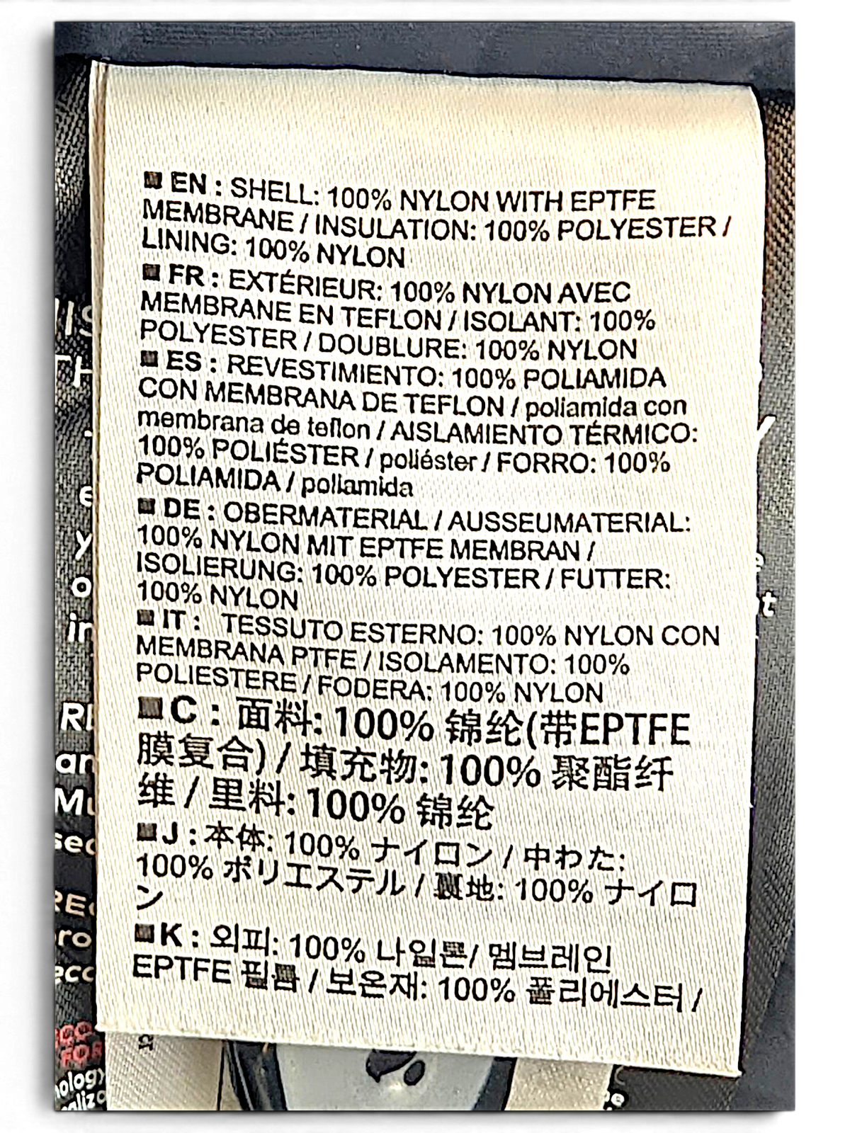 Arc'teryx jacket composition label showing nylon shell, polyester insulation and RECCO