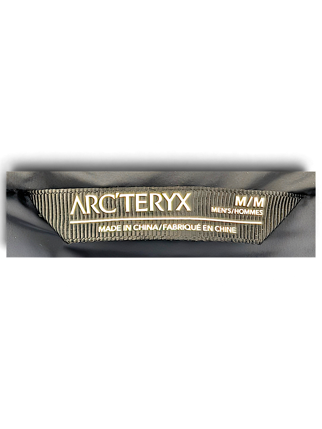 Arc'teryx Beta Insulated Jacket neck label, tagged size M and made in China