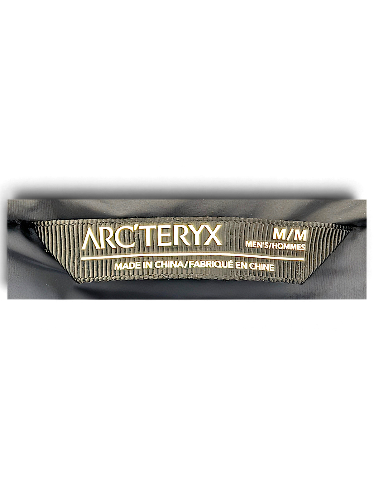Arc'teryx Beta Insulated Jacket neck label, tagged size M and made in China