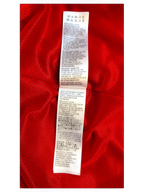 JAKE & IPI Balenciaga x Adidas clothing care label with multi-language washing instructions on red fabric