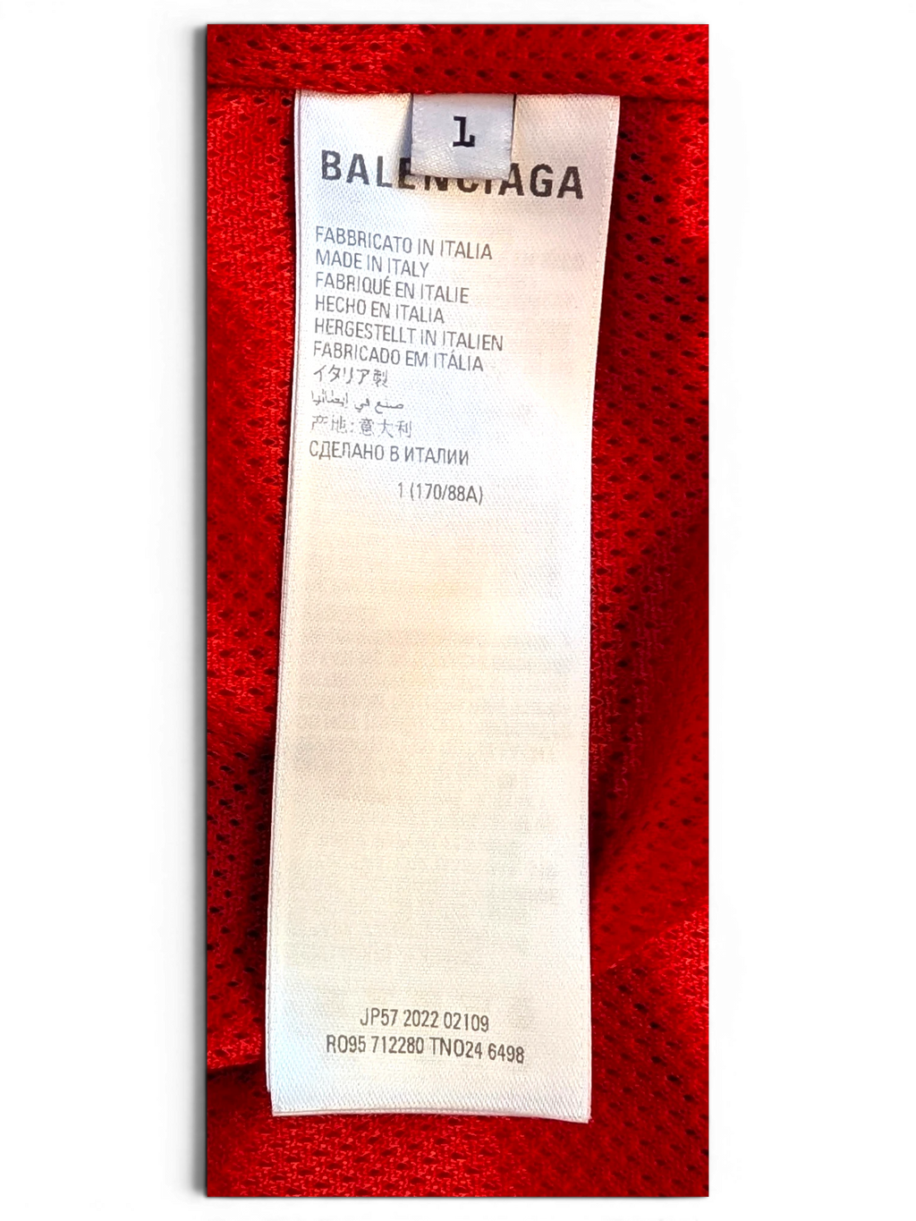 JAKE & IPI Balenciaga x Adidas clothing interior care label with size L and Made in Italy text on red mesh fabric