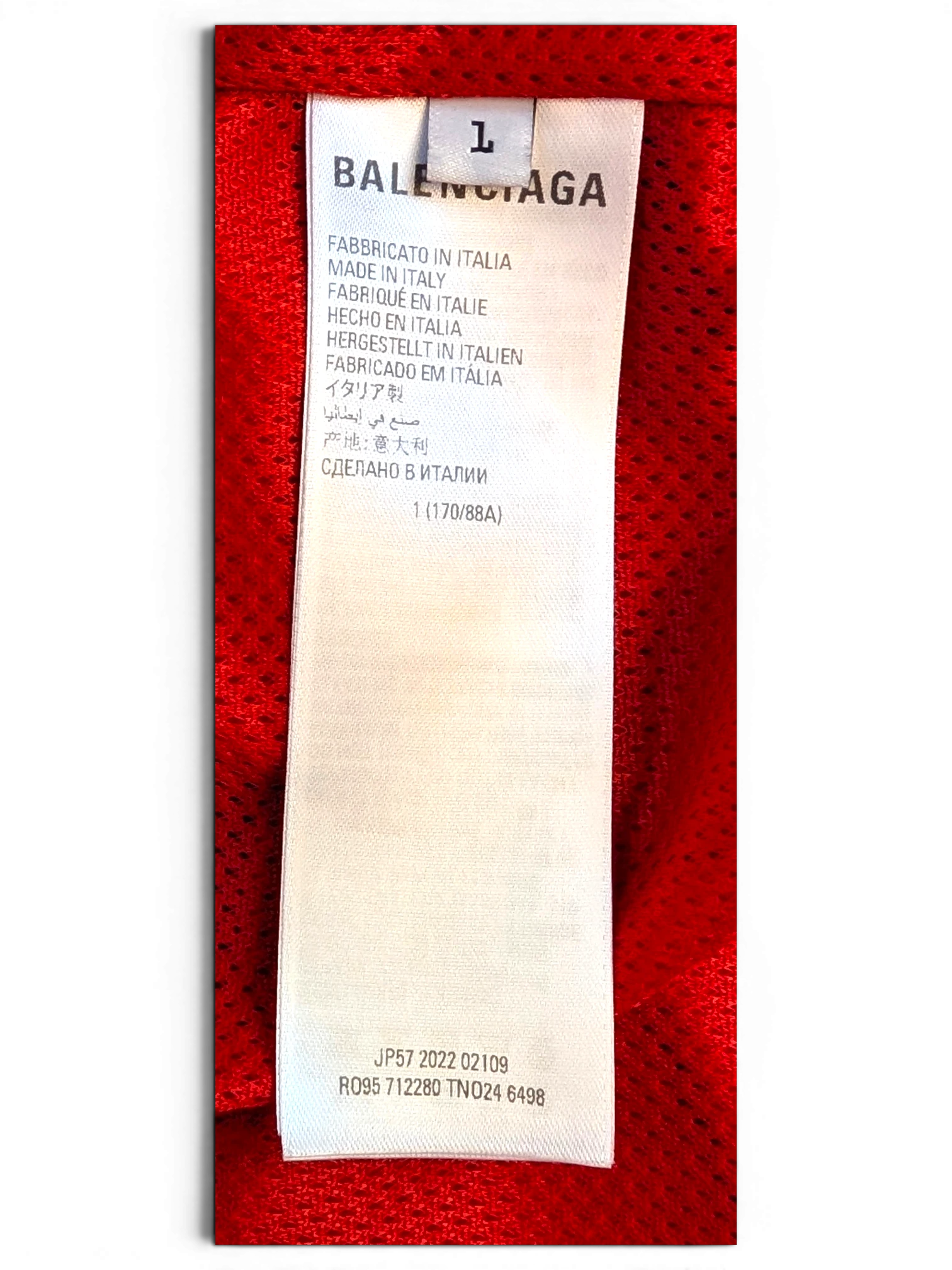 JAKE & IPI Balenciaga x Adidas clothing interior care label with size L and Made in Italy text on red mesh fabric