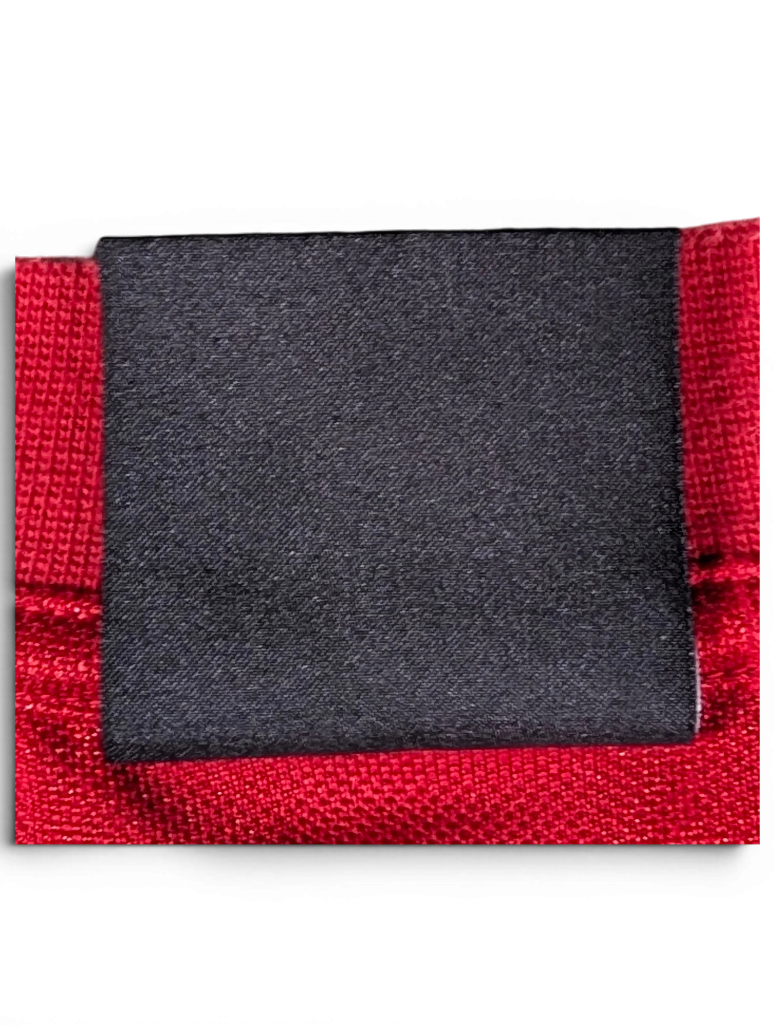 JAKE & IPI Balenciaga x Adidas jersey featuring a blank black fabric label on a textured red athletic material
