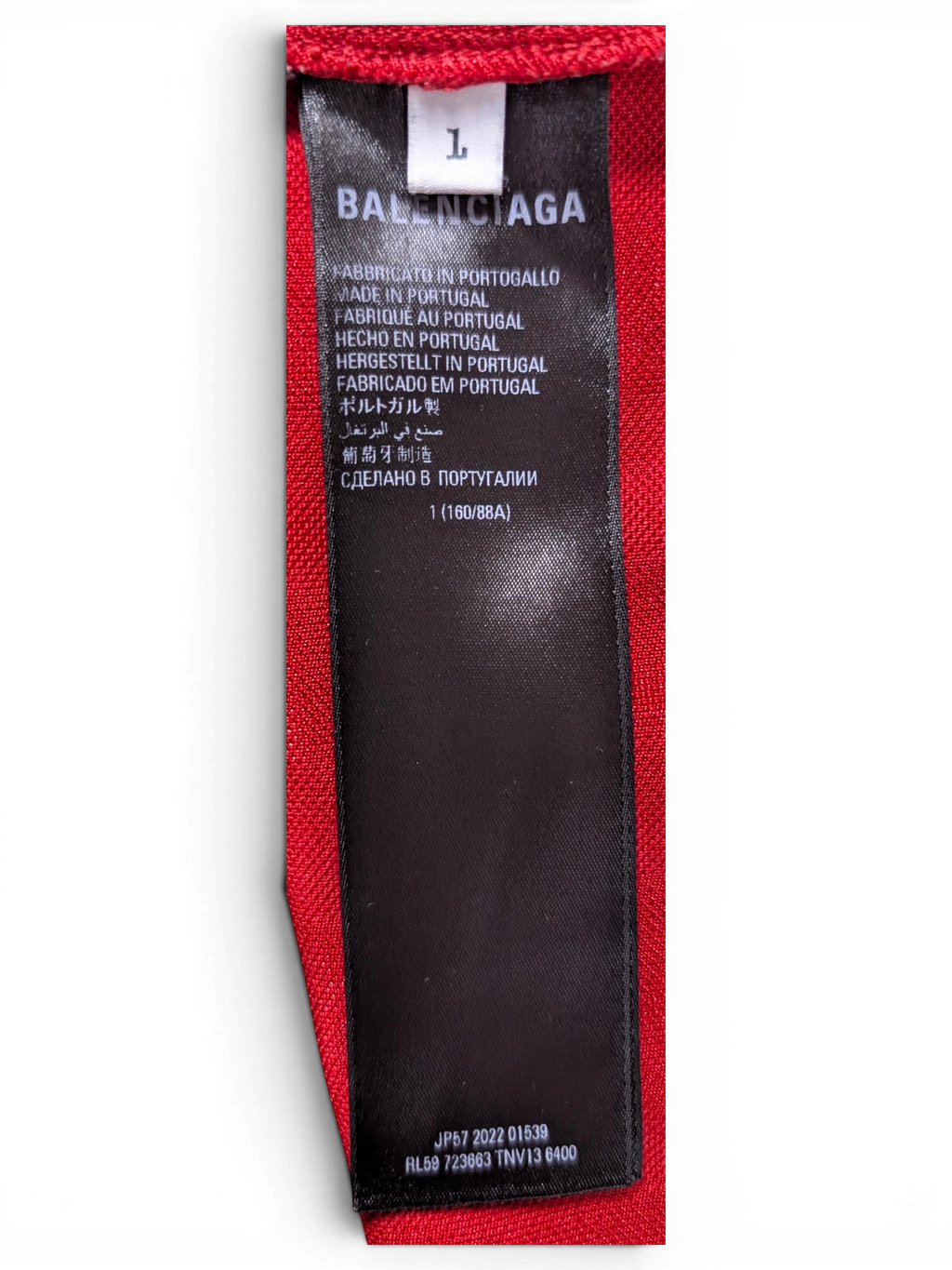 JAKE & IPI Balenciaga x Adidas jersey clothing label showing size L and made in Portugal details on red fabric