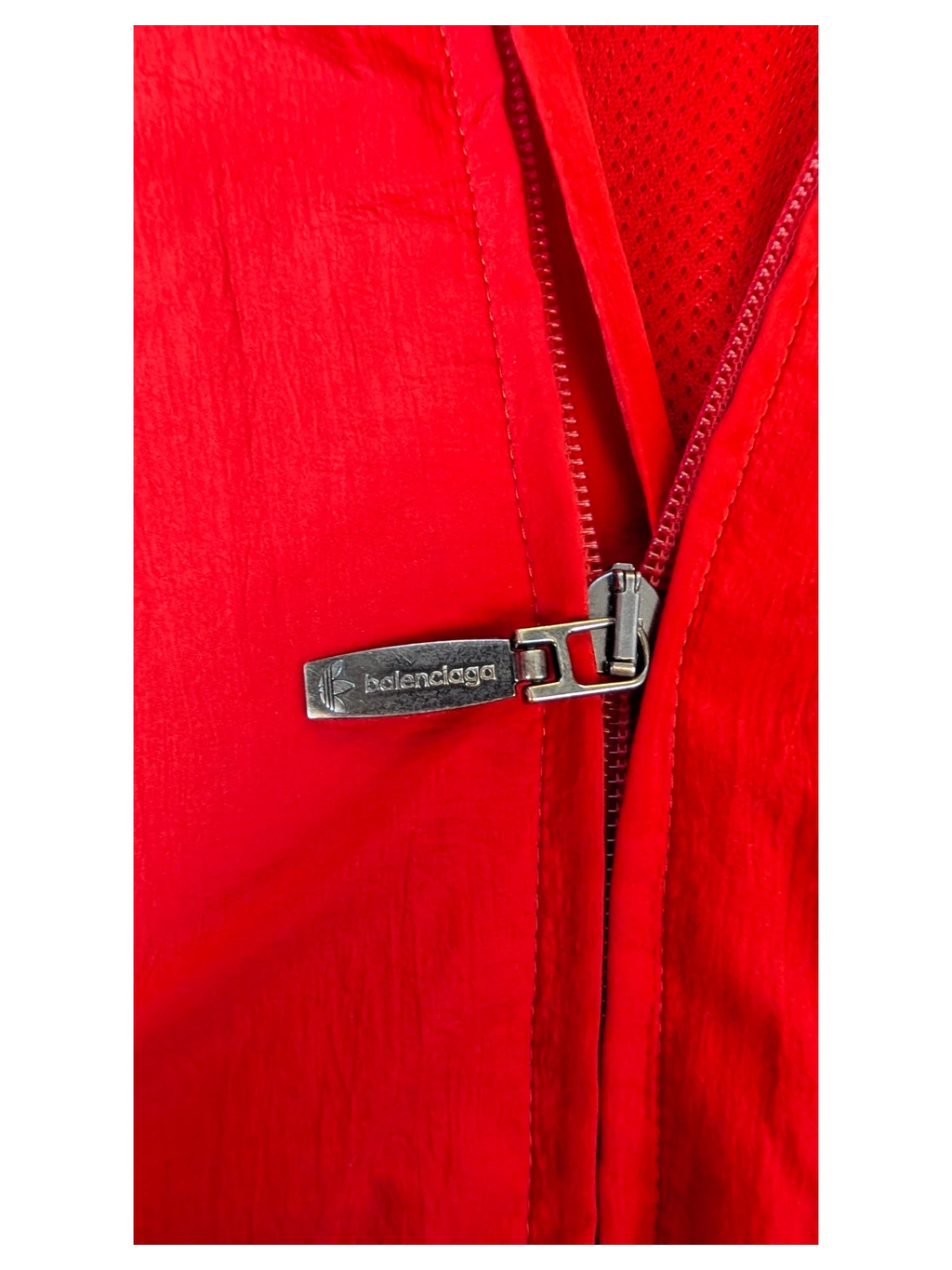 JAKE & IPI Balenciaga x Adidas red nylon jacket featuring a branded silver metal zipper pull